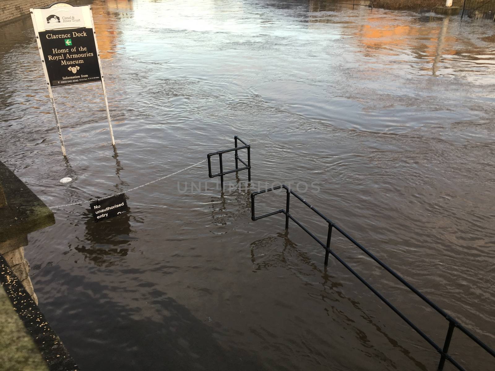 UNITED-KINGDOM, Leeds : Parts of Leeds near the Royal Armouries museum are submerged in flood waters after heavy rainfall hits northern England on December 27, 2015 in West Yorkshire. December 2015 has been the wettest on record for parts of the UK and has seen several communities swamped by rising waters, Met Office figures show. Flood alerts and warnings were issued since the beginning of the month across England and Wales as Storm Desmond, Eva then Frank take hold and bring torrential rain. The leader of Leeds City Council has said the authority had warned the Government that flooding in Leeds was a catastrophe waiting to happen on December 27, 2015. 
