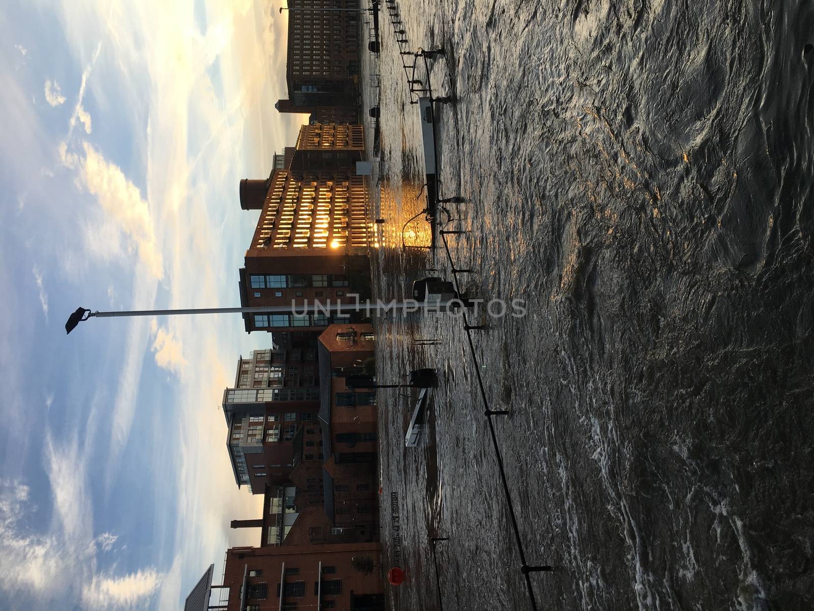 UNITED-KINGDOM, Leeds : Parts of Leeds near the Royal Armouries museum are submerged in flood waters after heavy rainfall hits northern England on December 27, 2015 in West Yorkshire. December 2015 has been the wettest on record for parts of the UK and has seen several communities swamped by rising waters, Met Office figures show. Flood alerts and warnings were issued since the beginning of the month across England and Wales as Storm Desmond, Eva then Frank take hold and bring torrential rain. The leader of Leeds City Council has said the authority had warned the Government that flooding in Leeds was a catastrophe waiting to happen on December 27, 2015. 