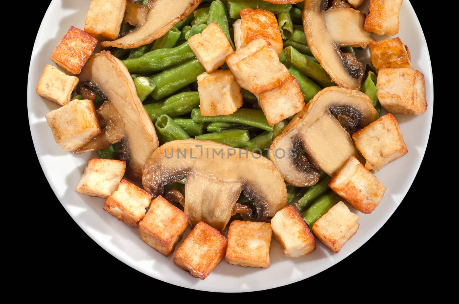 Fried mushrooms, beans and cheese on a platter. Isolated on a black background.