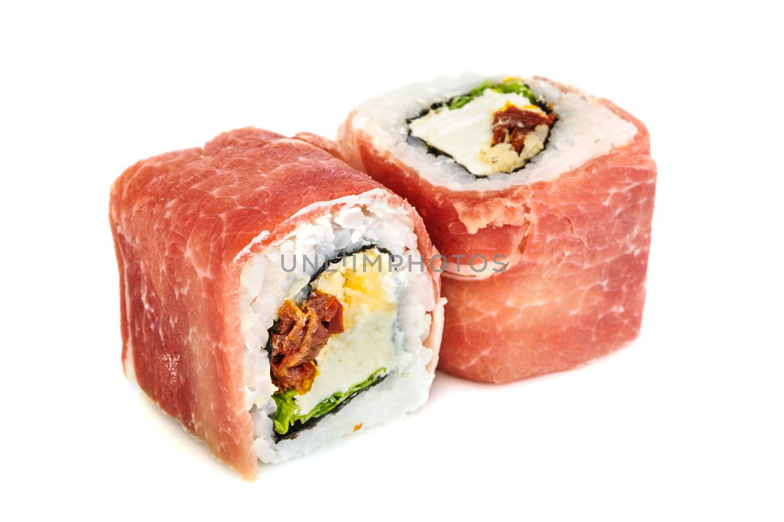 Uramaki maki sushi with prosciutto crudo, two rolls isolated on white. Letuce, philadelphia cheese, dried tomatoes, parmigiano