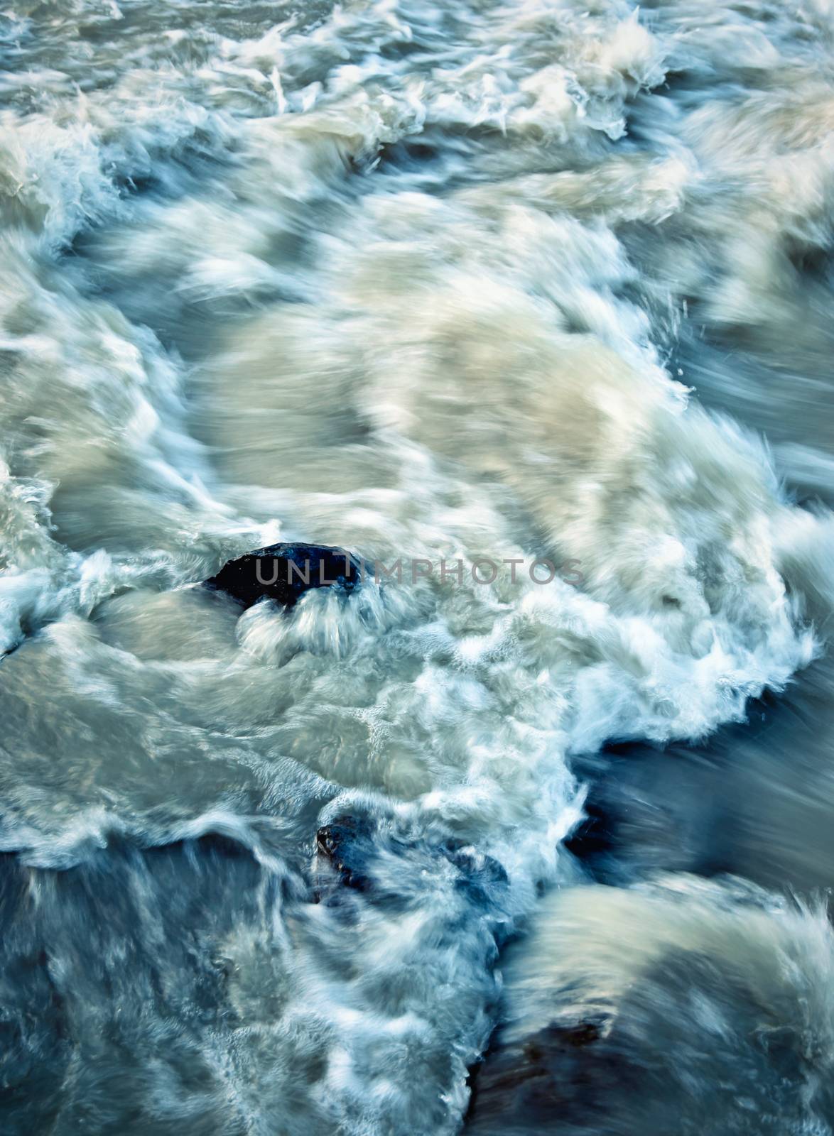 abstract background fierce rapids river swollen by rain