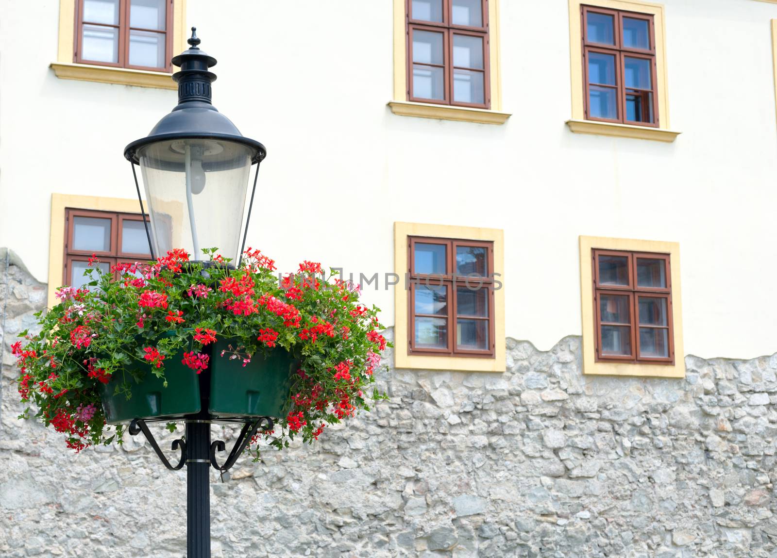 street lamp with hanging flower baskets