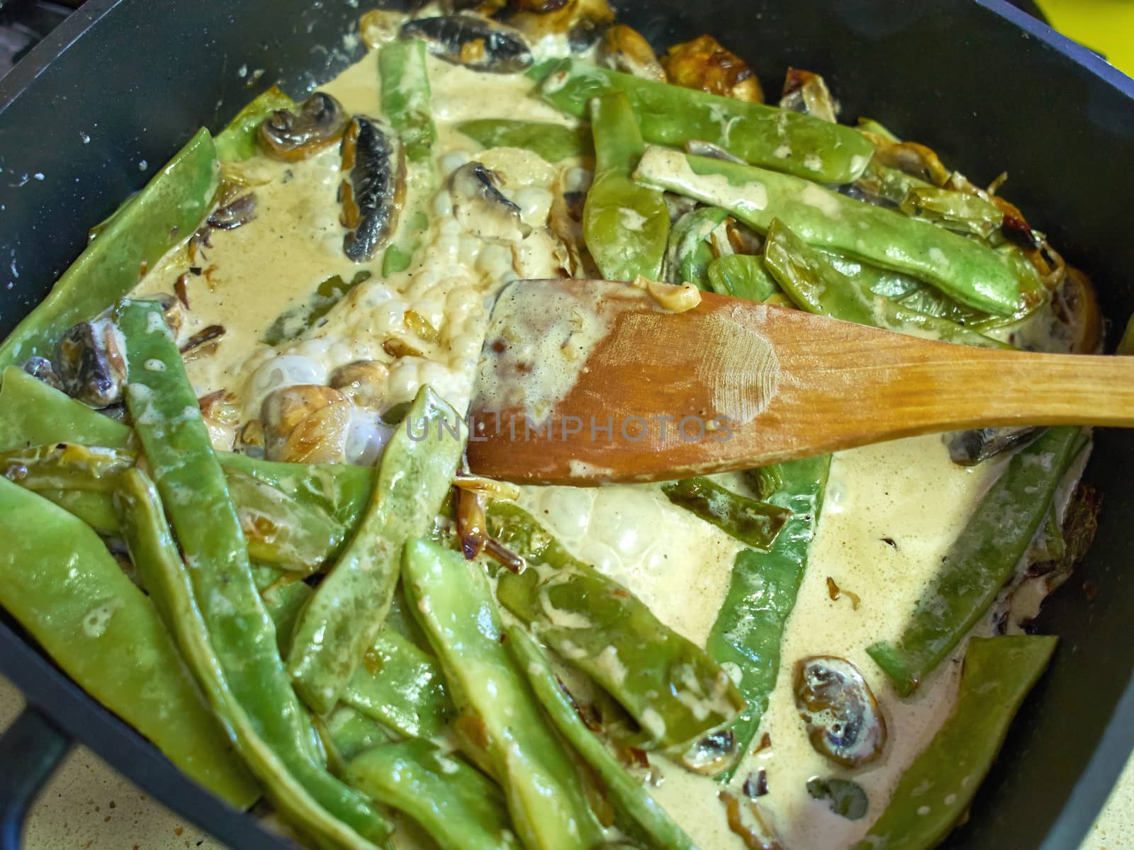 Green beans and mushrooms cooking in skillet by Ronyzmbow