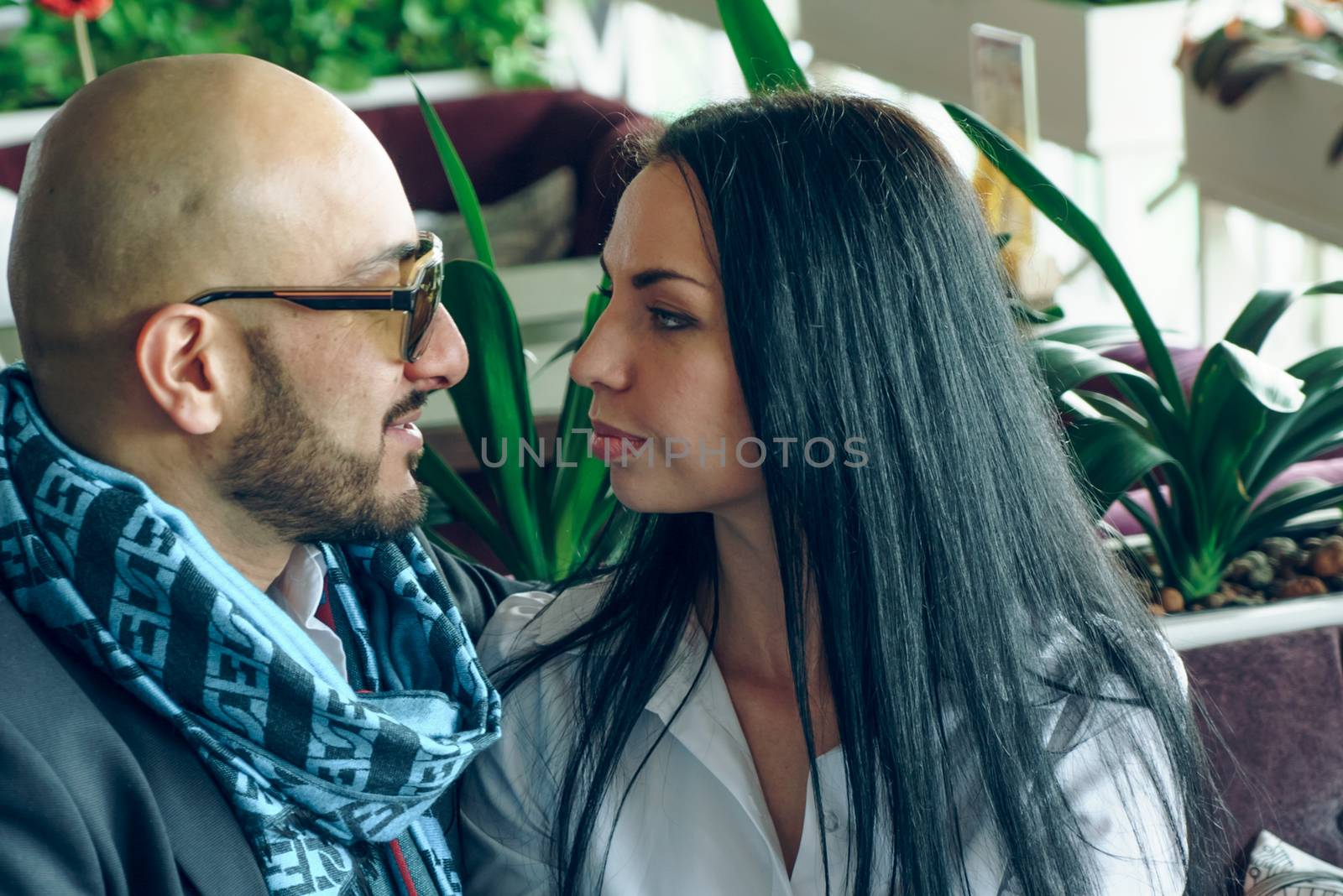 Arab man sits, hugs a beautiful girl by vipvn