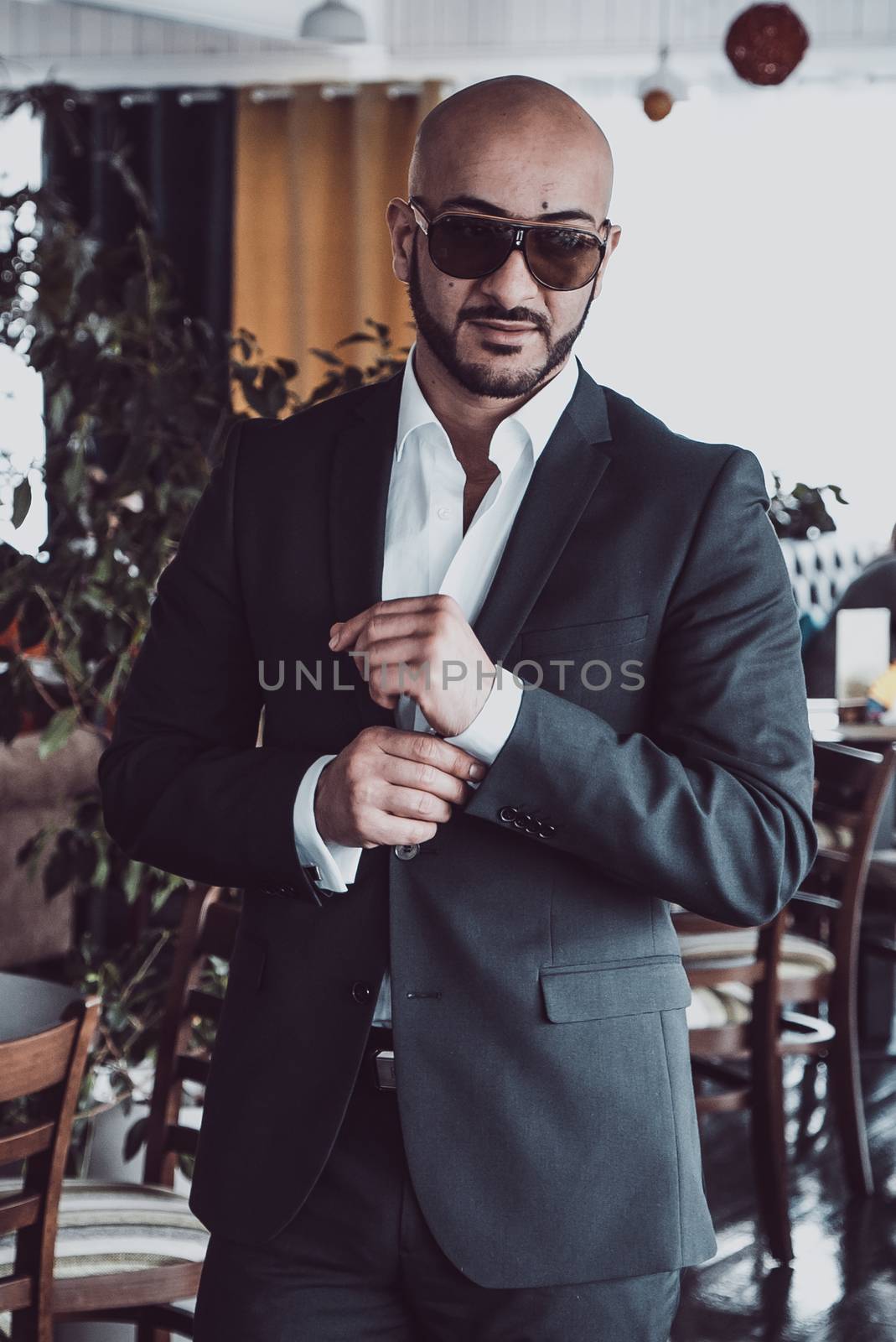 Arab businessman posing for the camera in restaurant