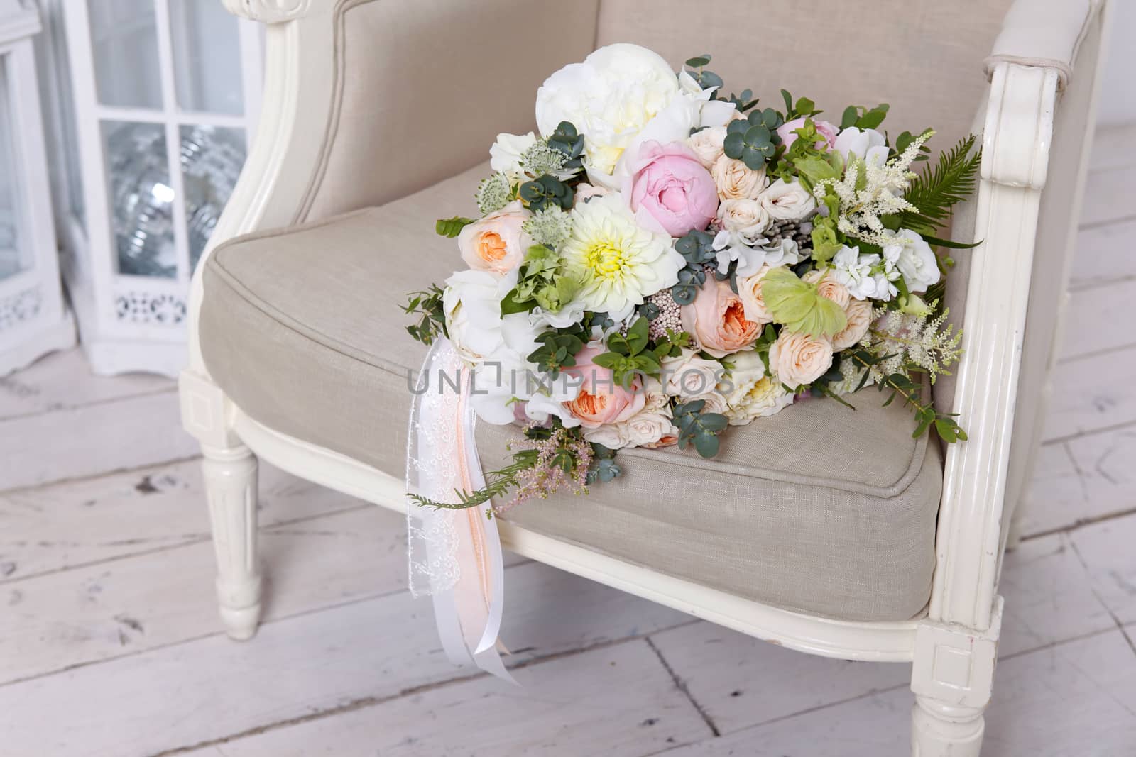 Beautiful wedding bouquet, forgotten on a vintage chair