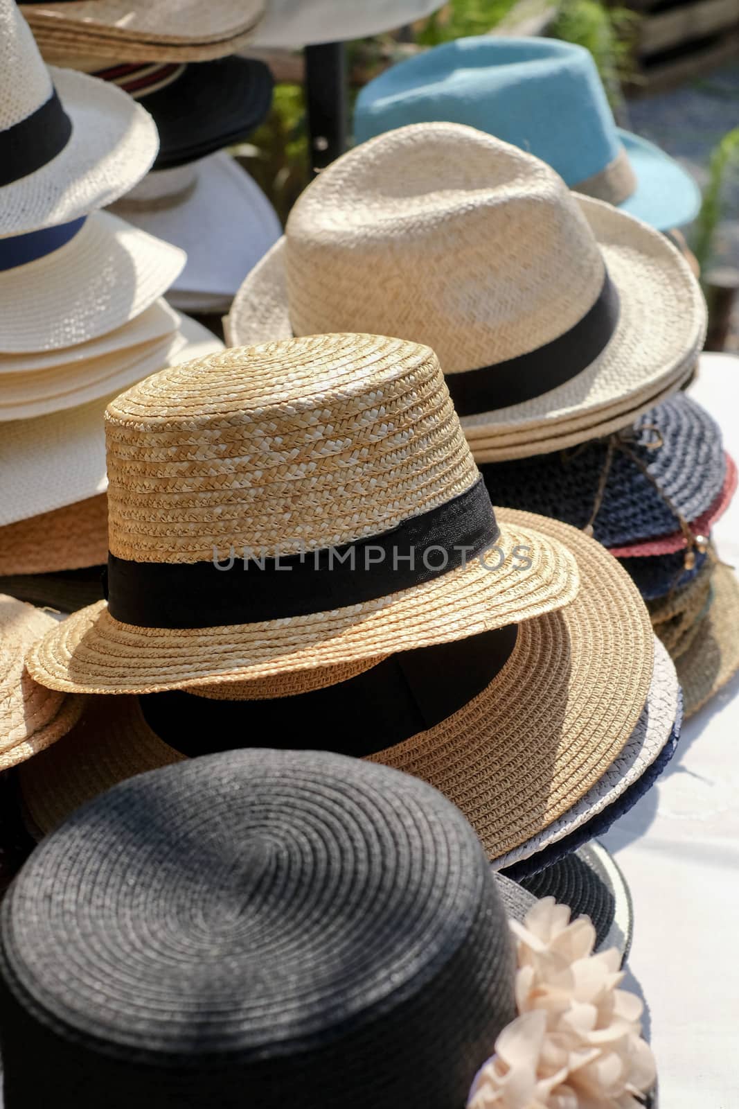 stacked different kinds of hats and head covers