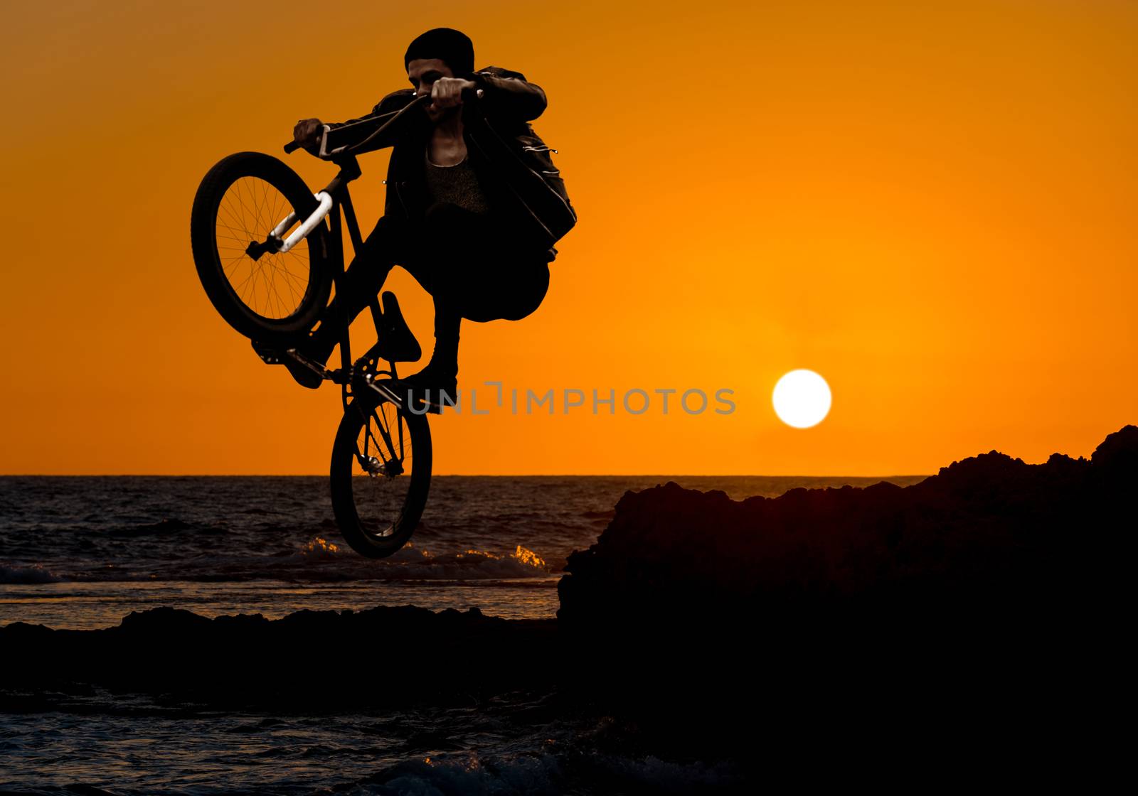 extreme sport bmx, jump on a sunset background