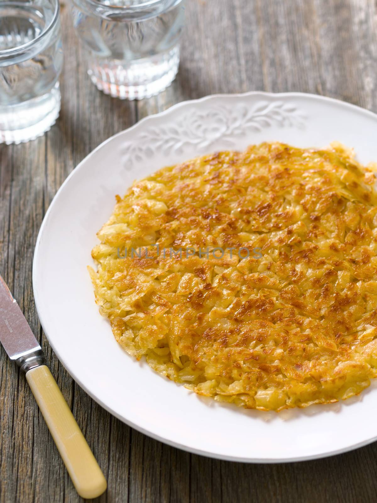 close up of rustic golden crispy swiss rosti