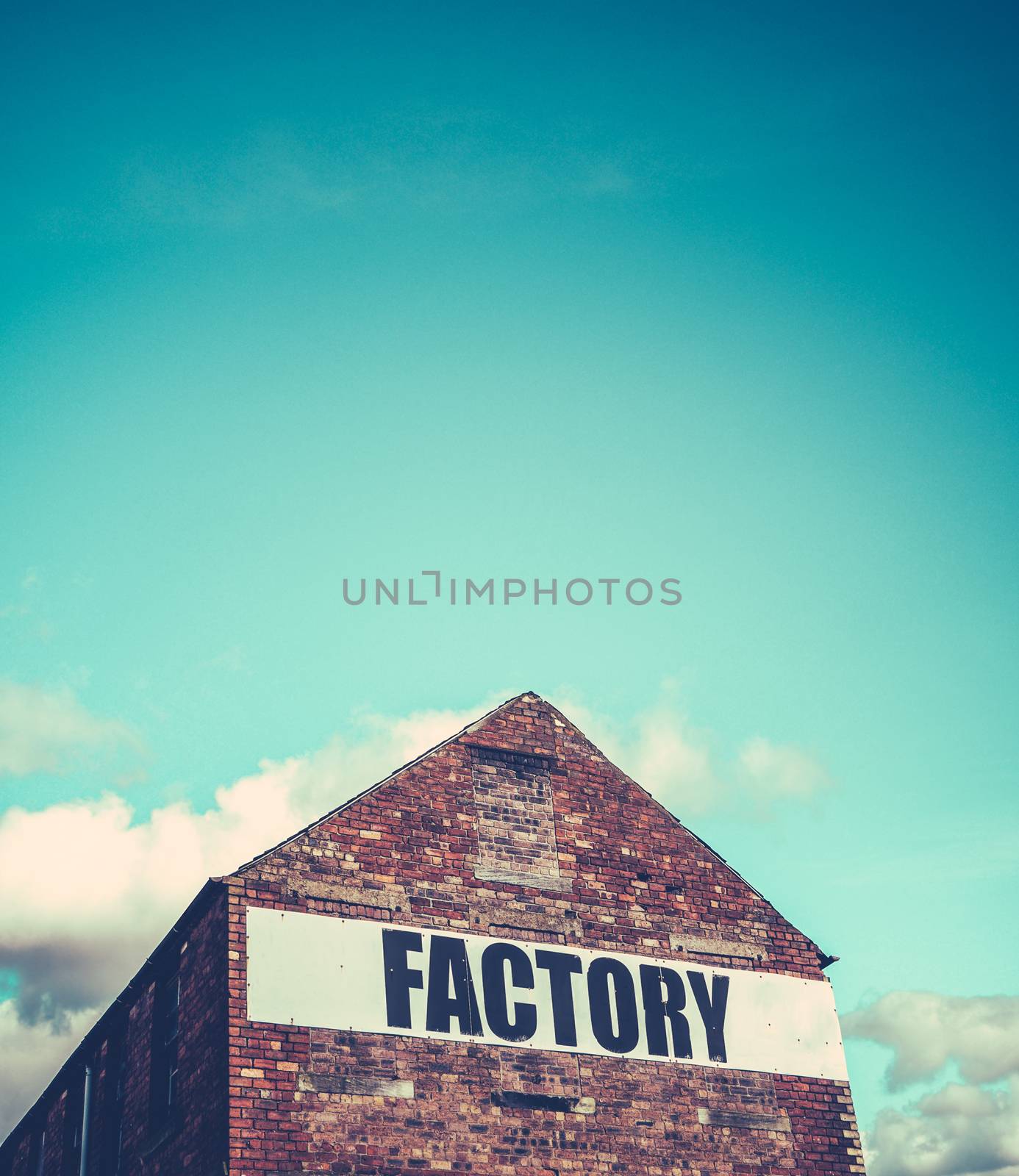 Urban Industrial Red Brick Factory Building With Blue Sky And Copy Space