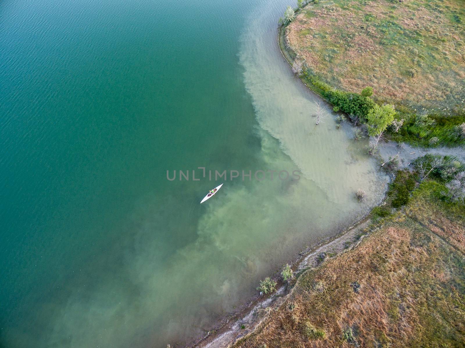 aerial view of a lake with canoe, summer evening in Colorado