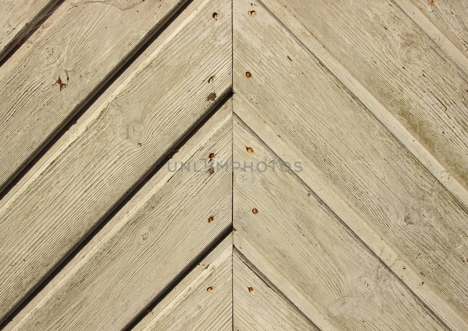 Handcrafted door plank lines with nails forming angle by HoleInTheBox