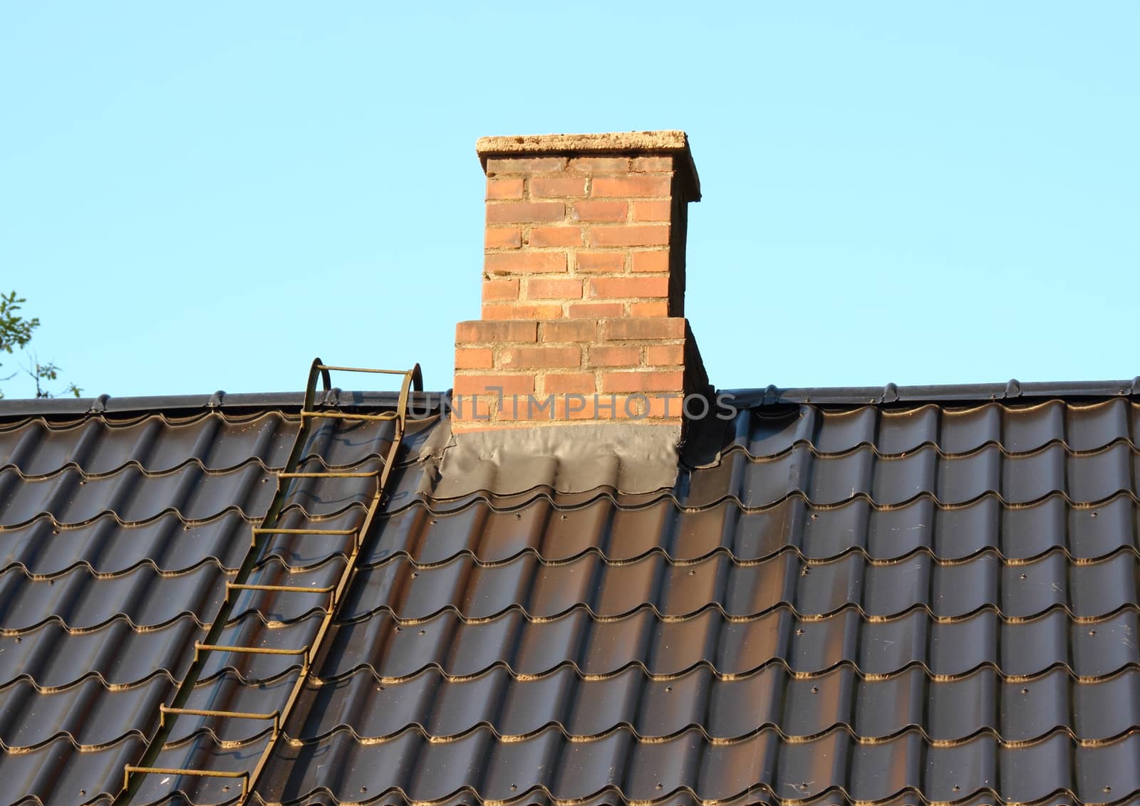 Brick chimney on black roof with metal ladder by HoleInTheBox