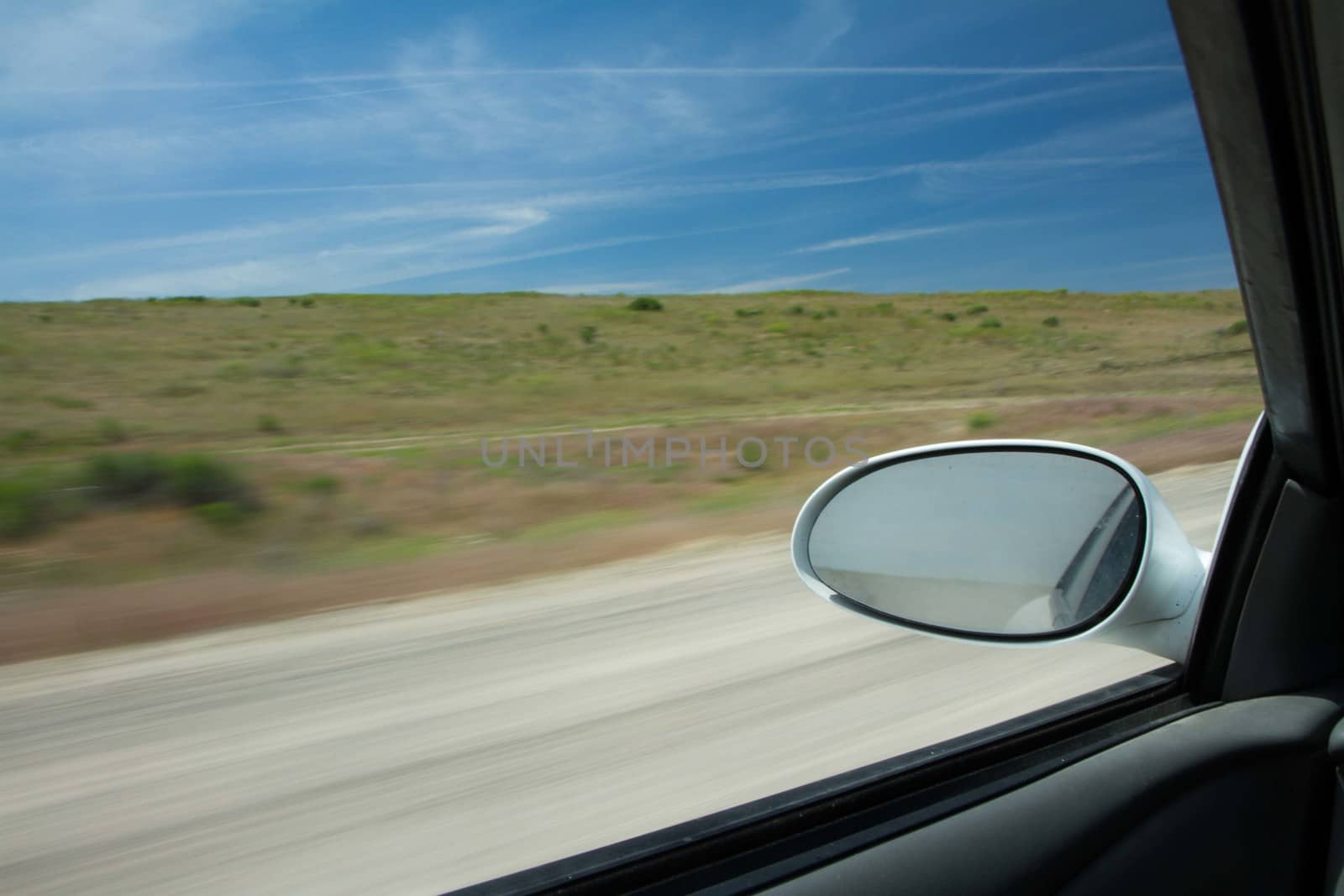 Trying to take a trip this car is moving fast down the road