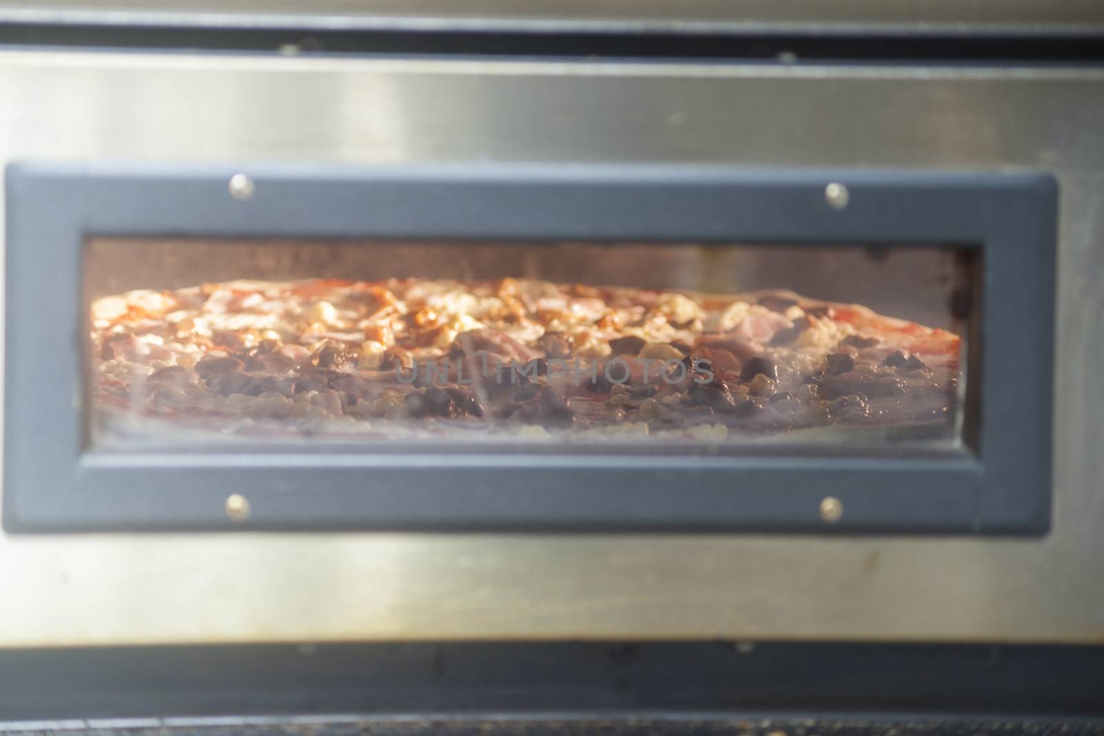 Pizza baking in the oven. High resolution