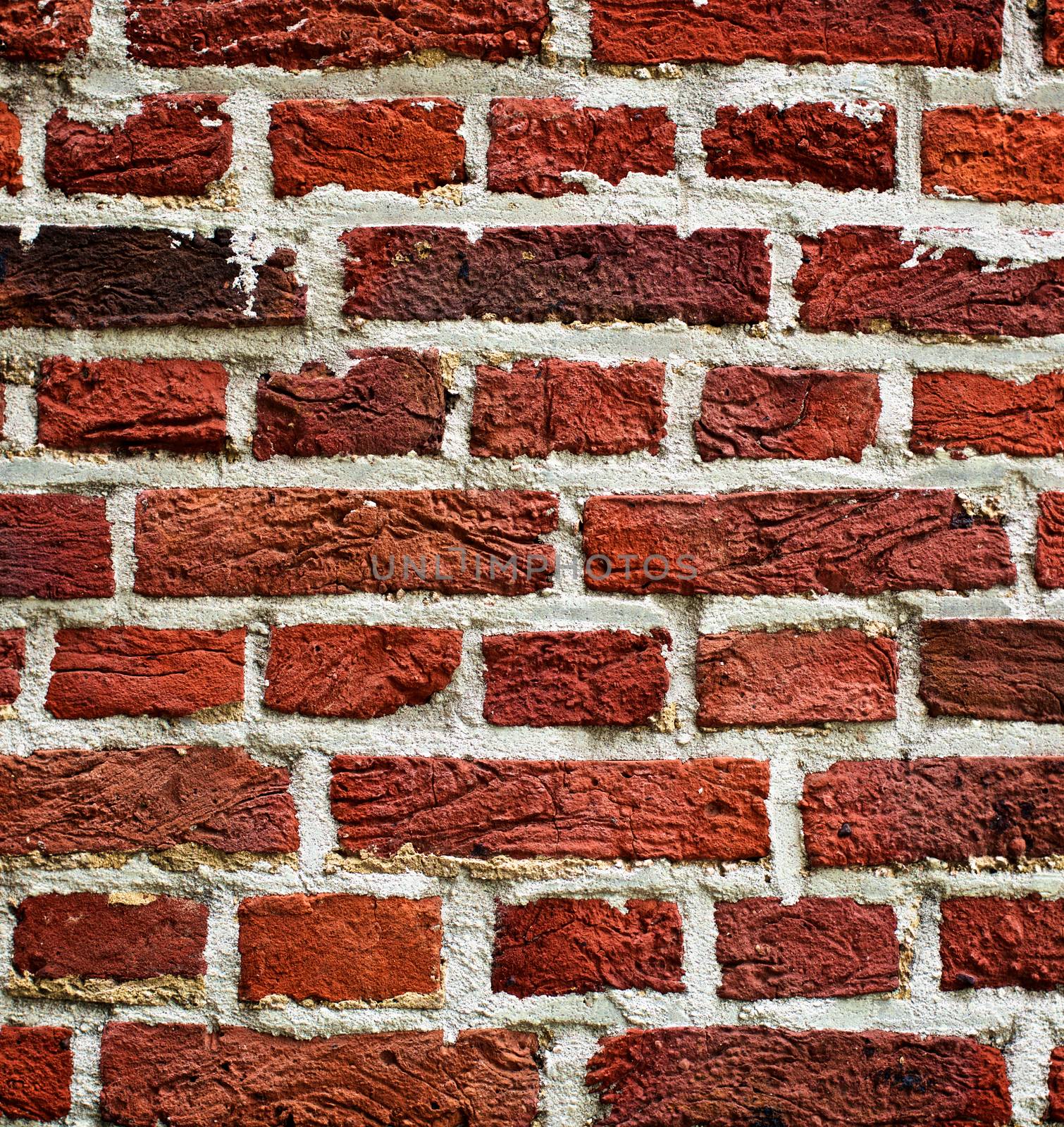 Background of Old Red Brick Wall with Cracked Concrete  closeup Outdoors