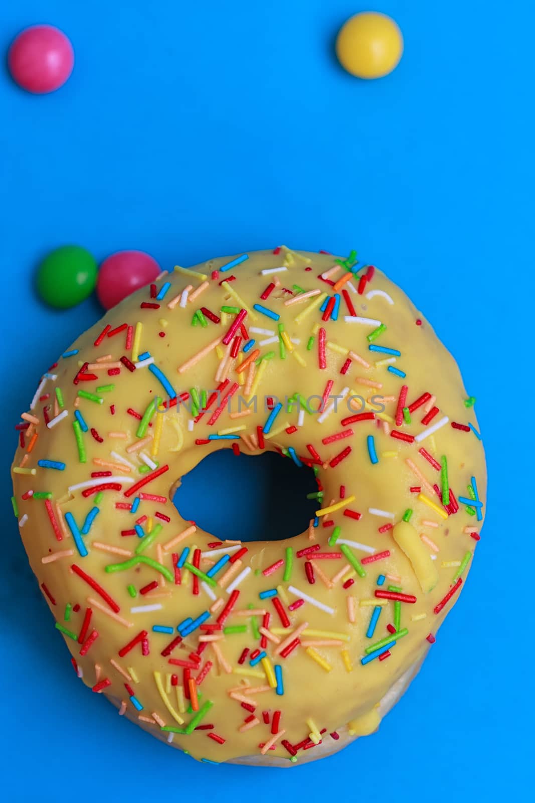 Round Donuts in the glaze on the blue background