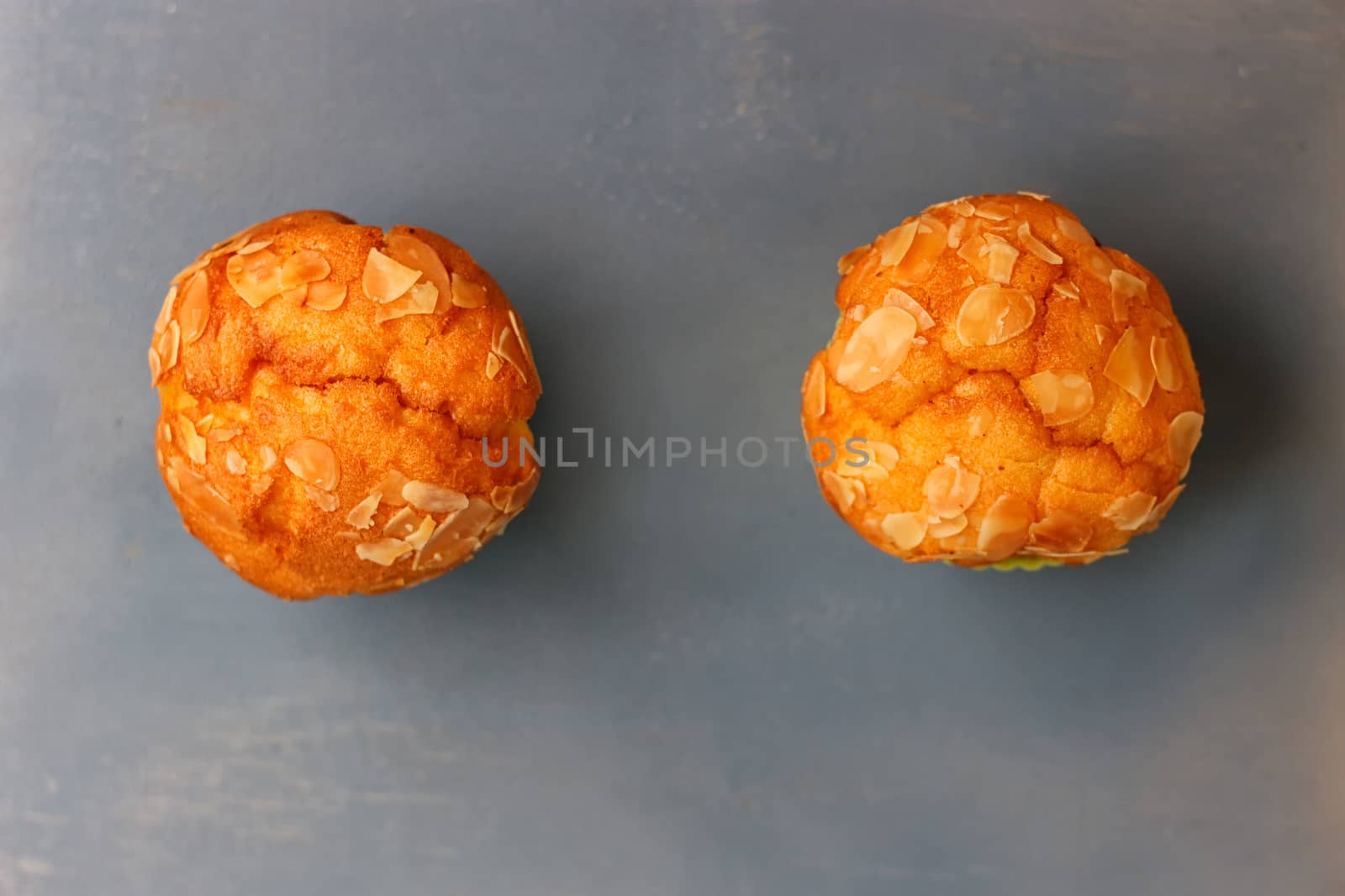 Muffins in silicone tins on a blue background