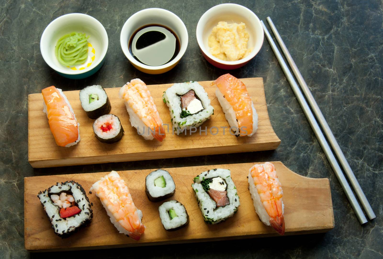 Selection of sushi including prawns, salmon and vegetables with rice