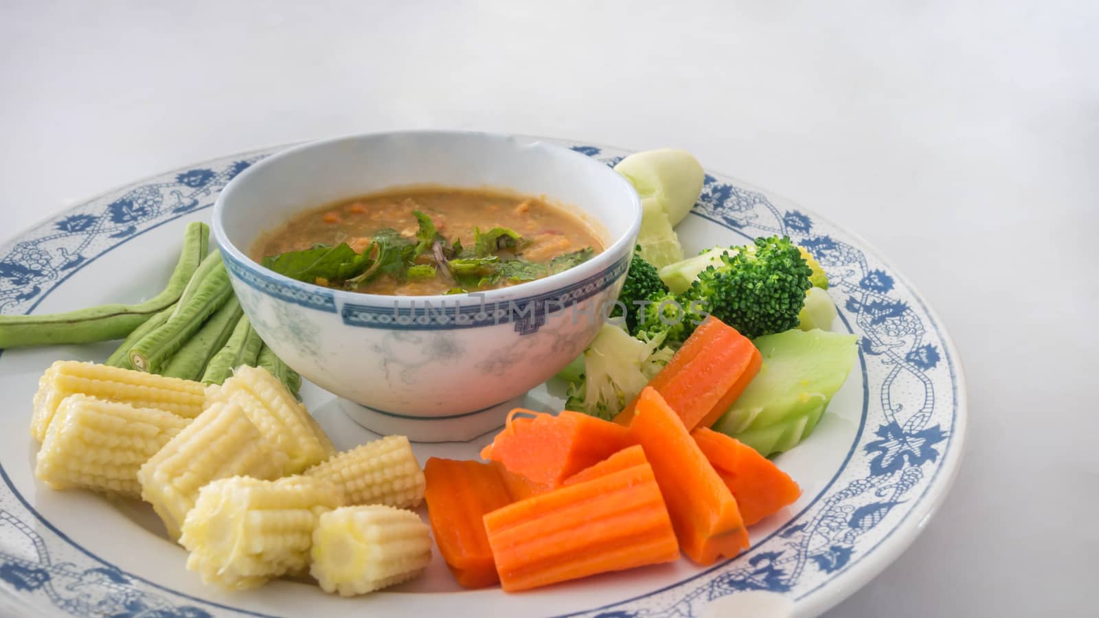 Spicy crab roe chili sauce served with vegetable on dish