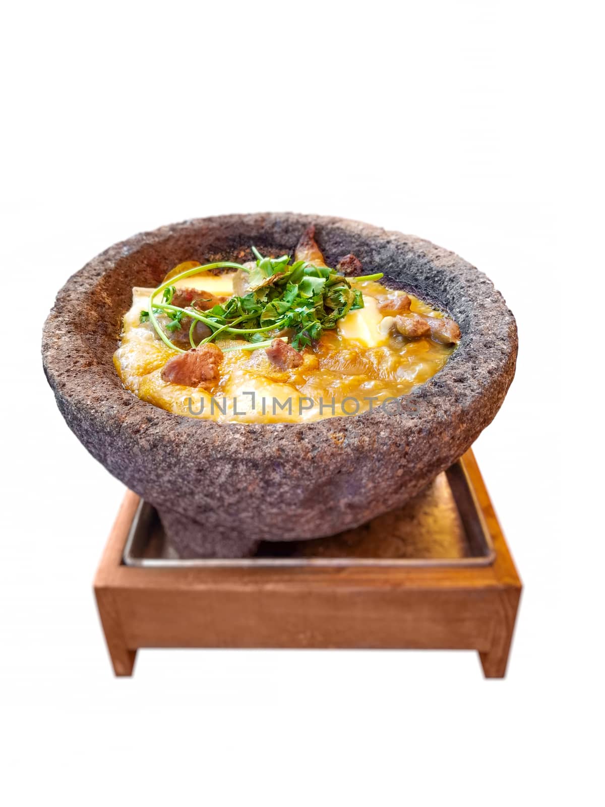 Molcajete isolated over white background. Molcajete is a traditional Mexican stone tool, and it's used for preparation and serving of different kinds of food.