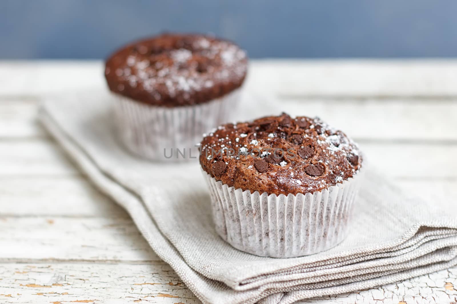 Two chocolate muffin on a fabric napkin