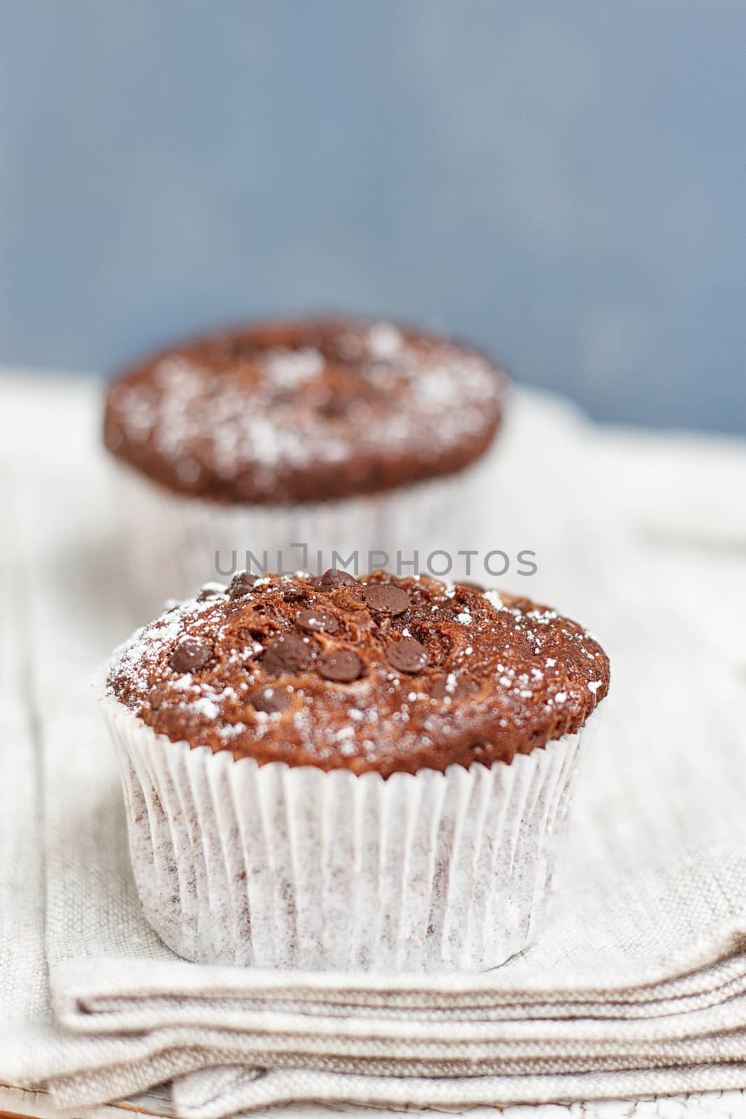 Two chocolate muffin on a fabric napkin