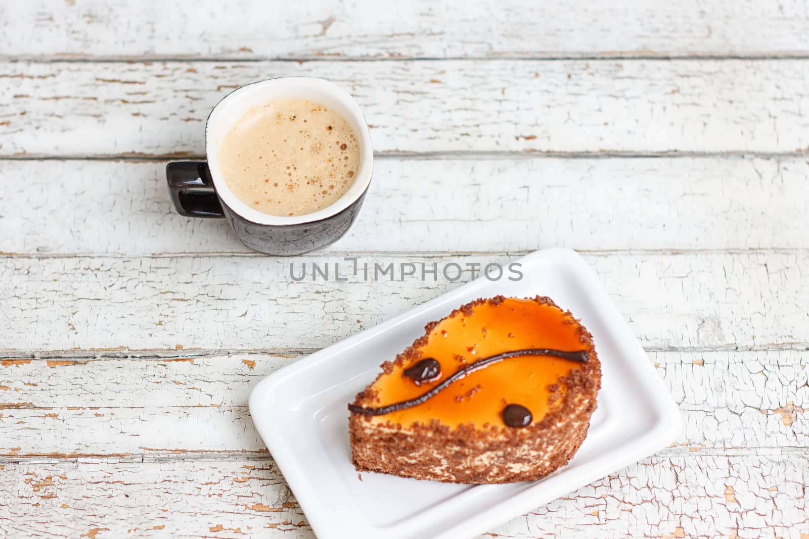 coffee cake and cup of coffee on old wooden table