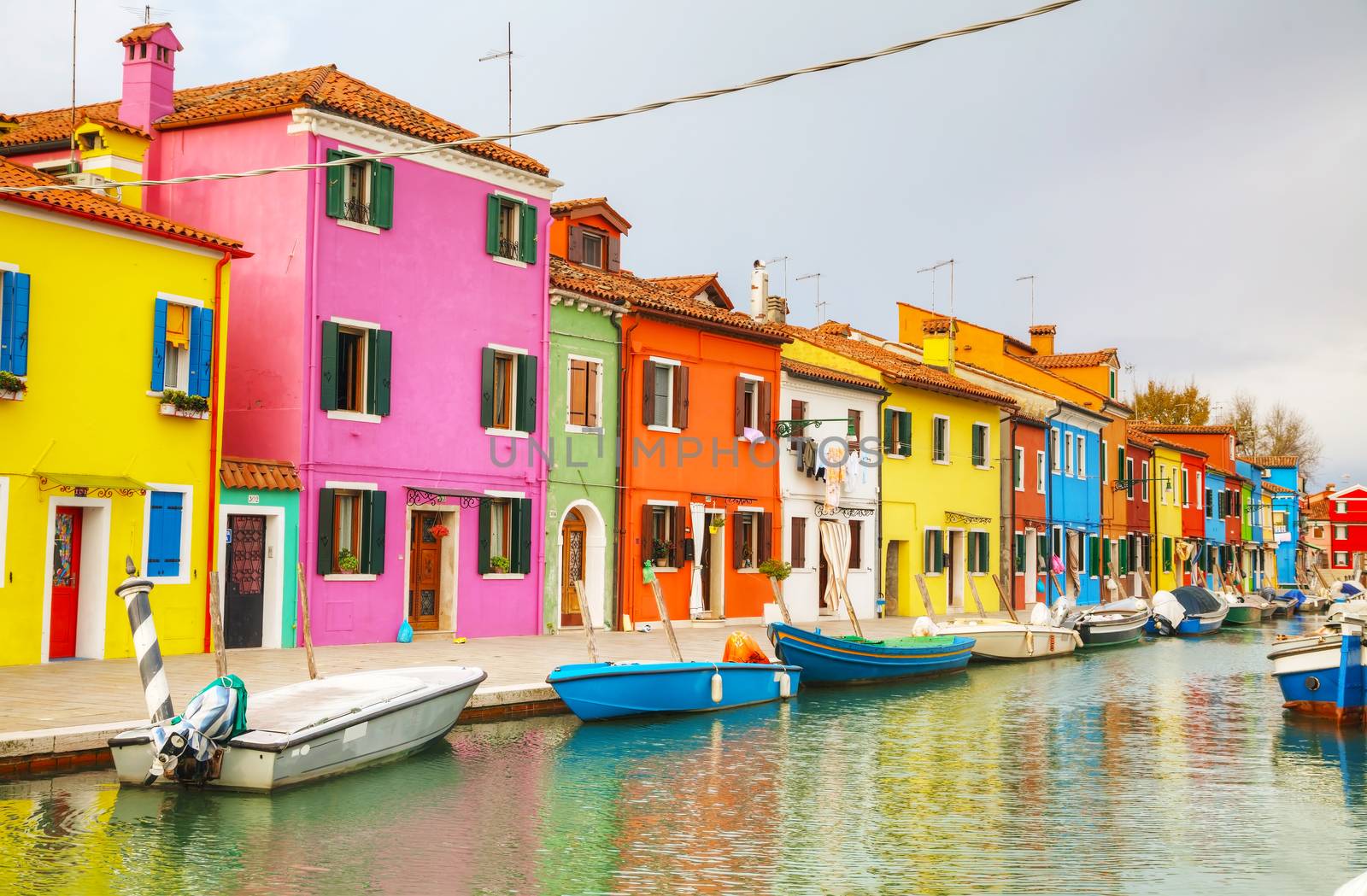 Brightly painted houses at the Burano canal by AndreyKr