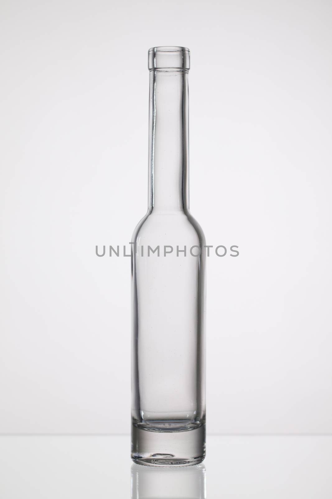 Empty bottle of water   on the glass desk
