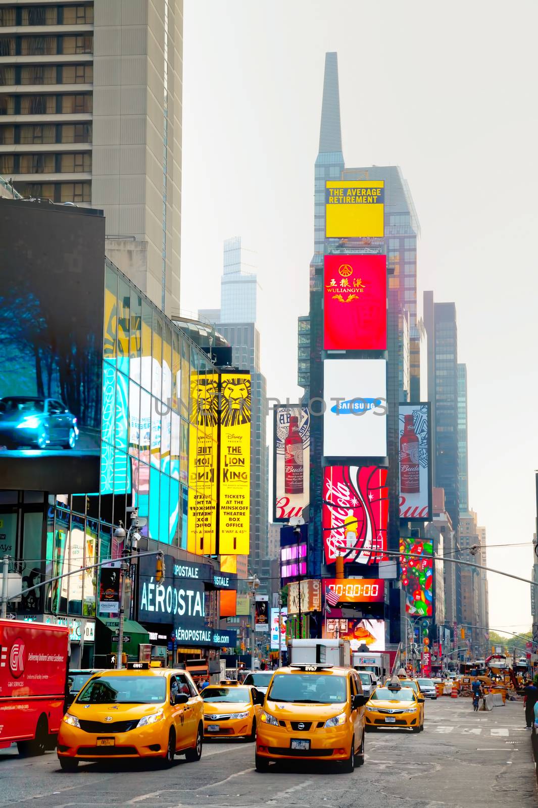 NEW YORK CITY - SEPTEMBER 04: Times square with people in the morning on October 4, 2015 in New York City. It's major commercial intersection and neighborhood in Midtown Manhattan at the junction of Broadway and 7th Avenue.