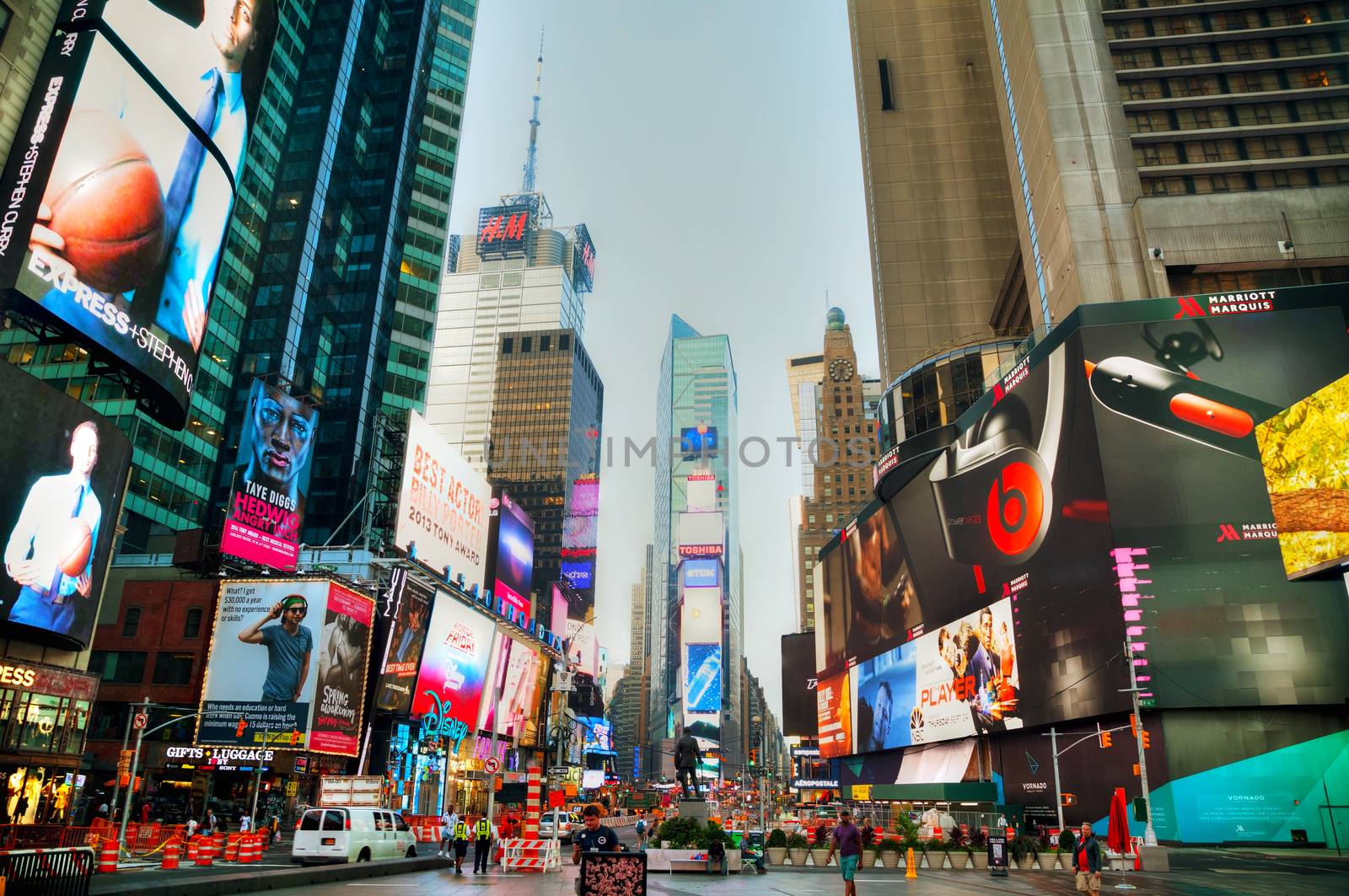 NEW YORK CITY - SEPTEMBER 04: Times square with people in the morning on October 4, 2015 in New York City. It's major commercial intersection and neighborhood in Midtown Manhattan at the junction of Broadway and 7th Avenue.