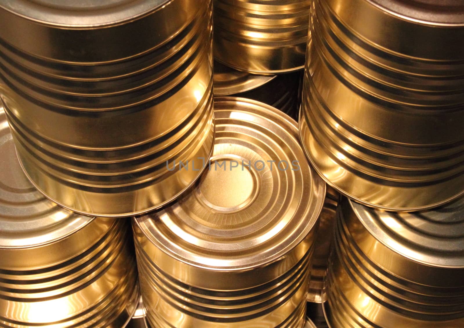 Topview of golden metal cans with line cut perspective