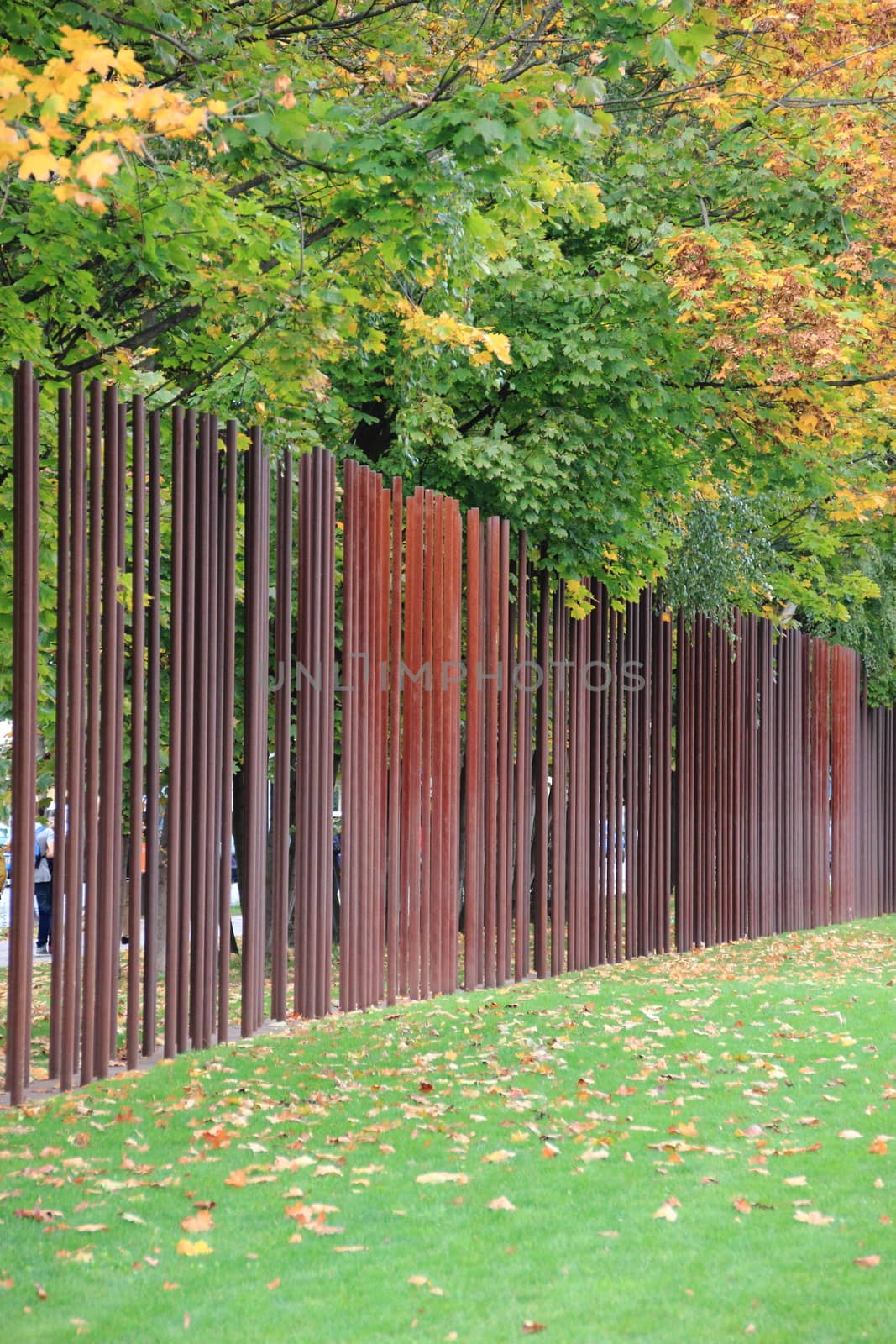 Berlin wall memorial Germany with iron markers in autumn by HoleInTheBox