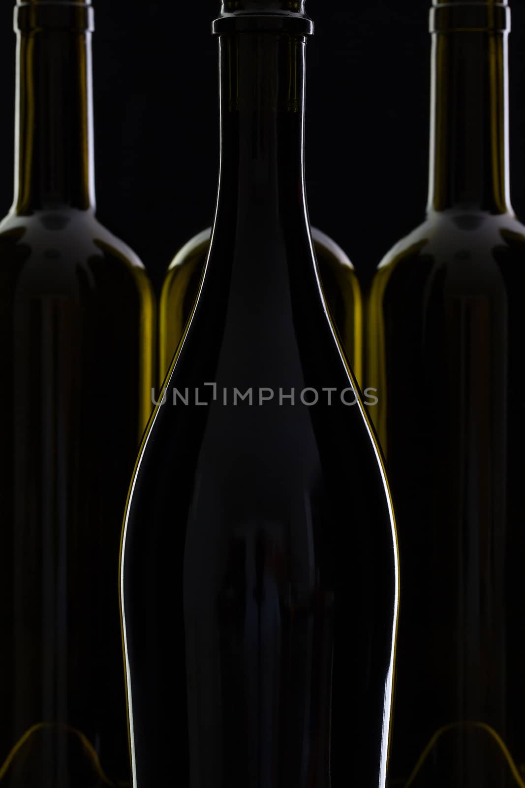 Four different bottles of wine by CaptureLight
