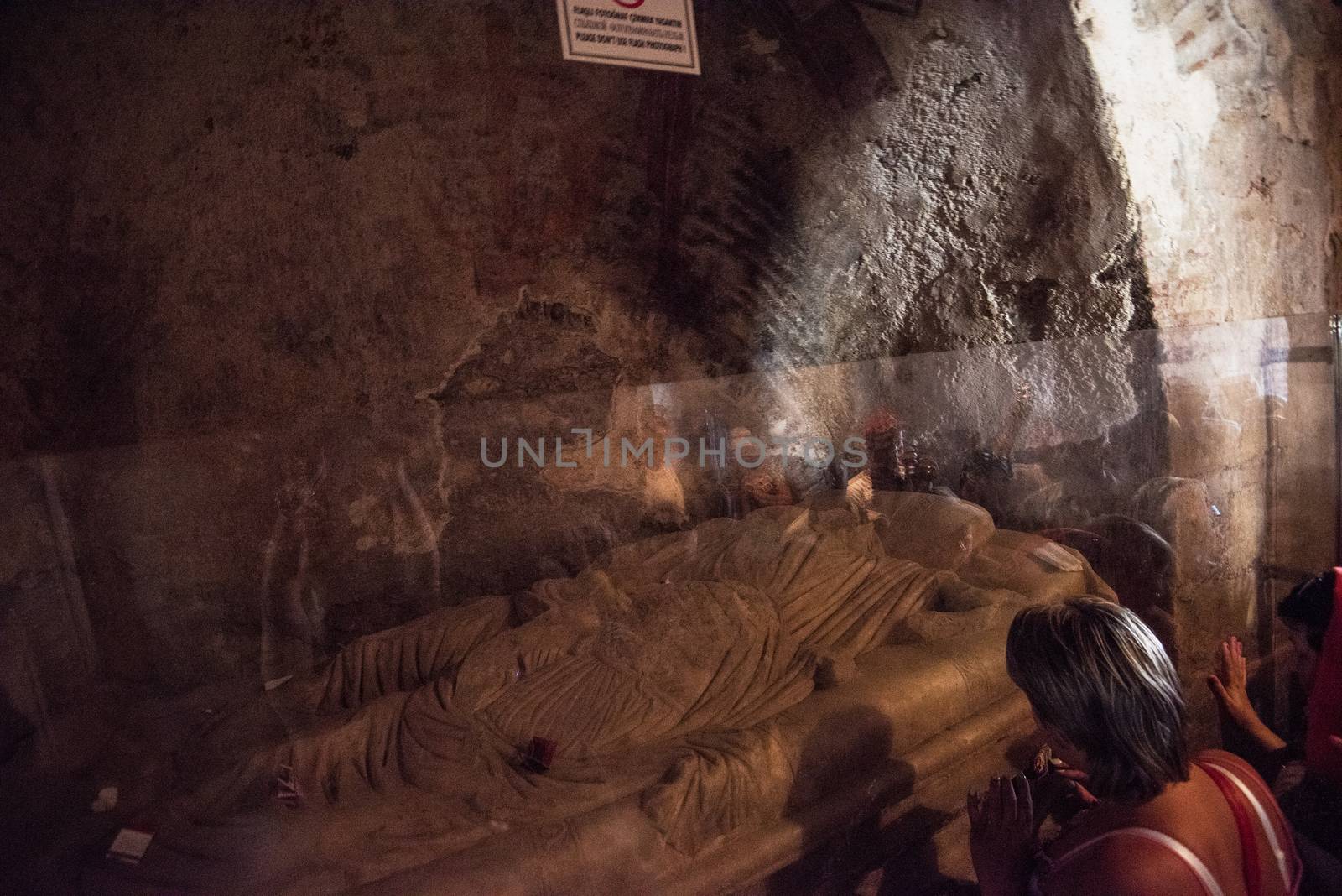 Demre, Turkey - July, 2015: people near sarcophagus of St Nicholas inside St. Nicholas church in Demre Turkey