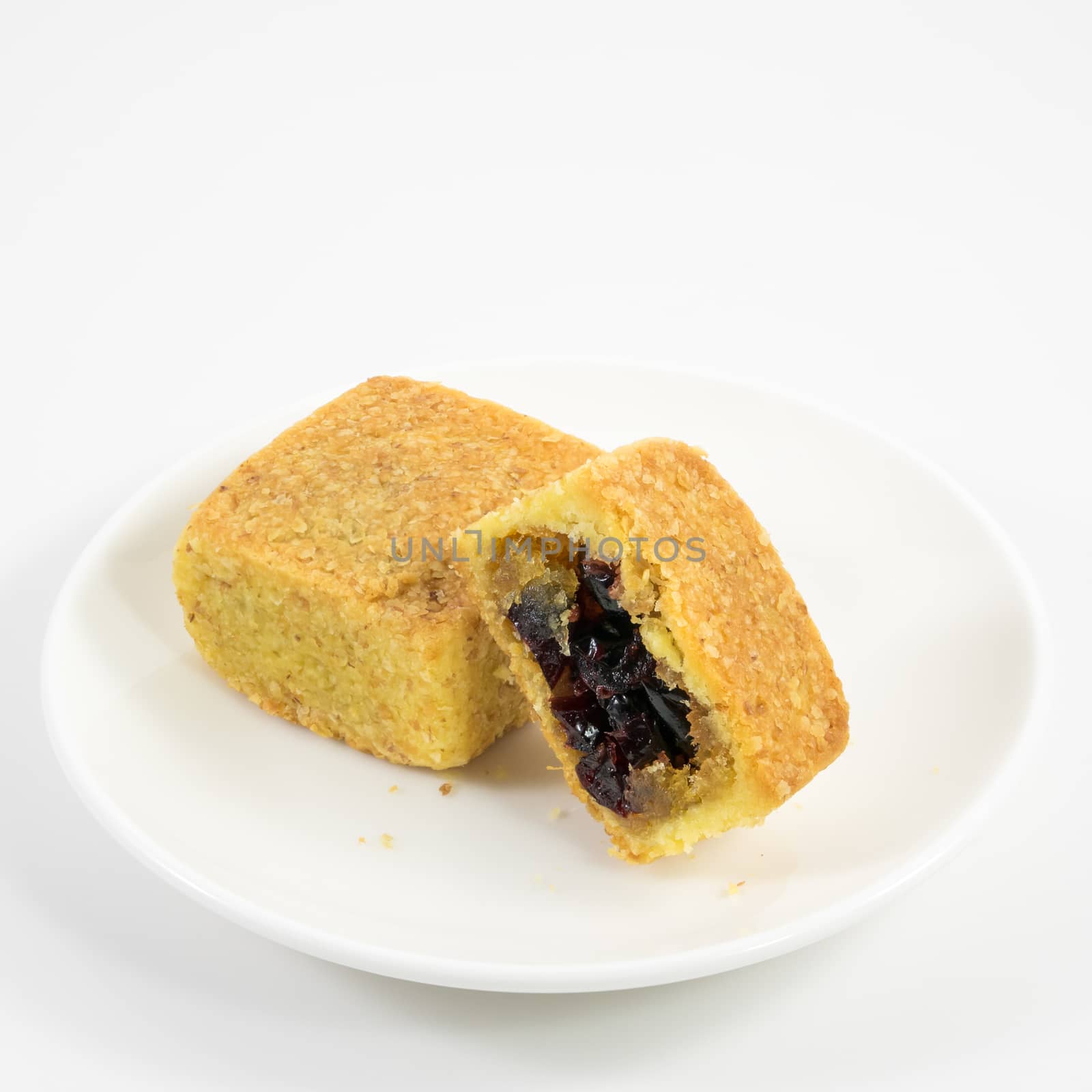 The tasty Taiwanese cranberry pastry cake on the small white dish.