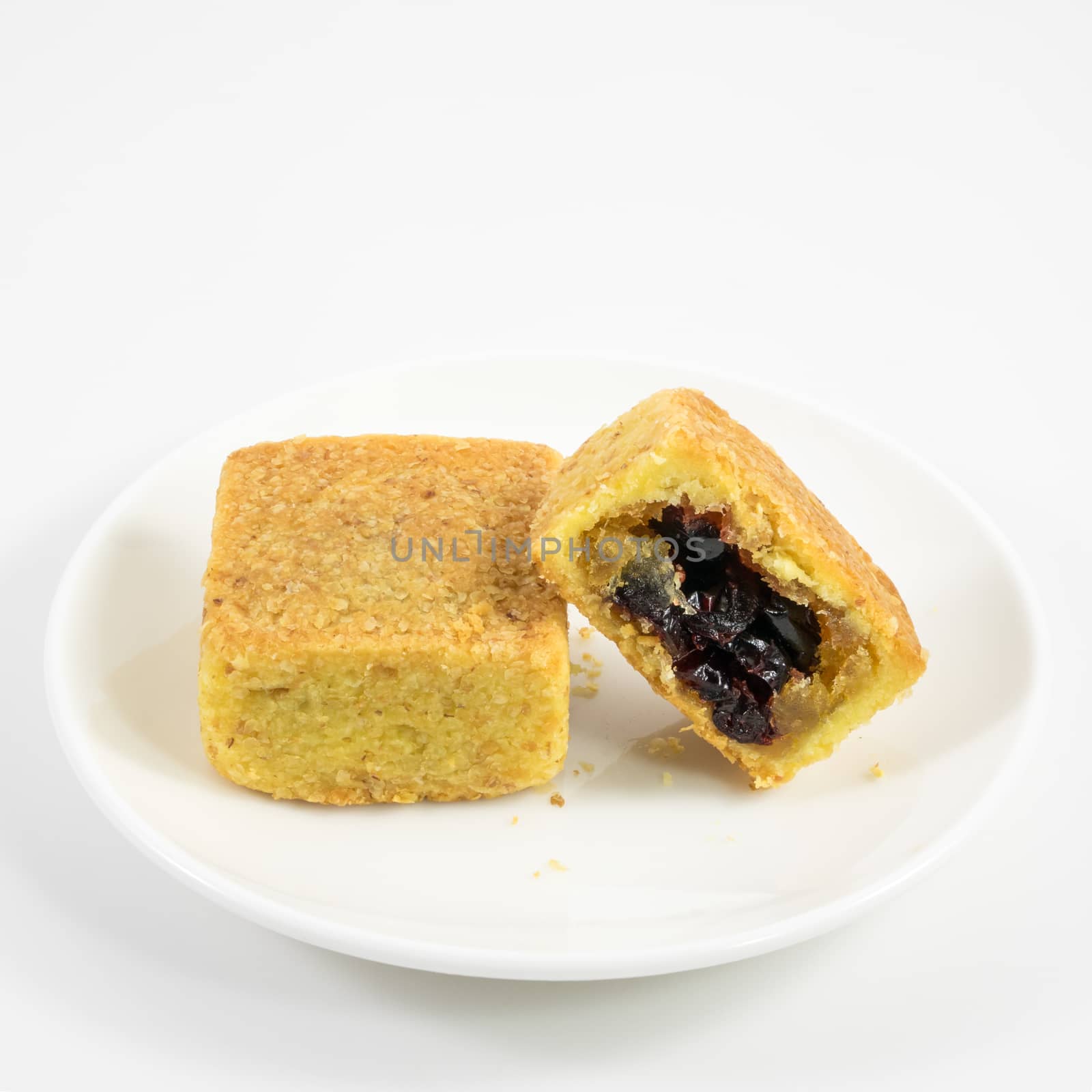 The tasty Taiwanese cranberry pastry cake on the small white dish.