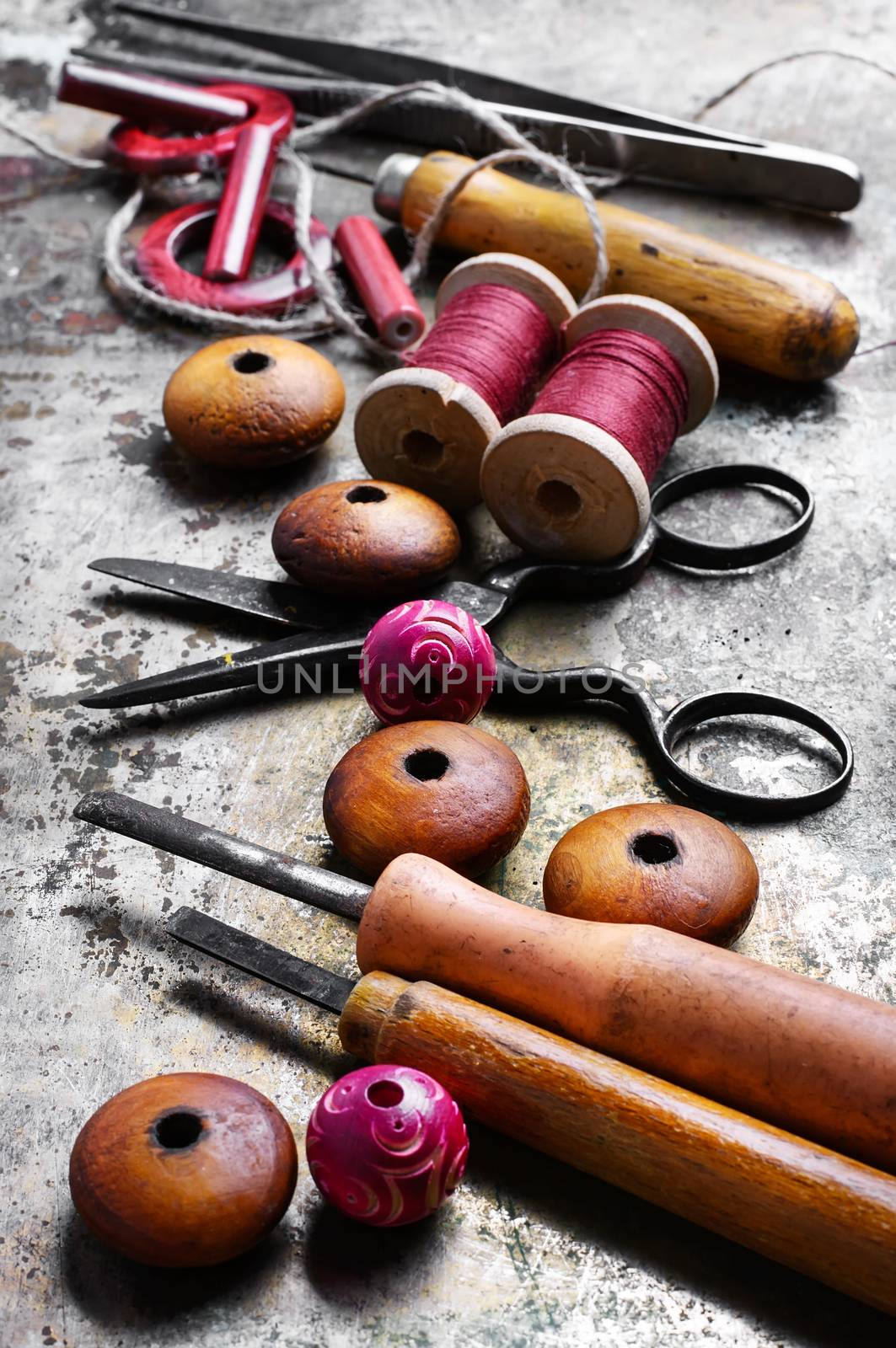 Wood beads jewelry and tool for making iron on vintage background