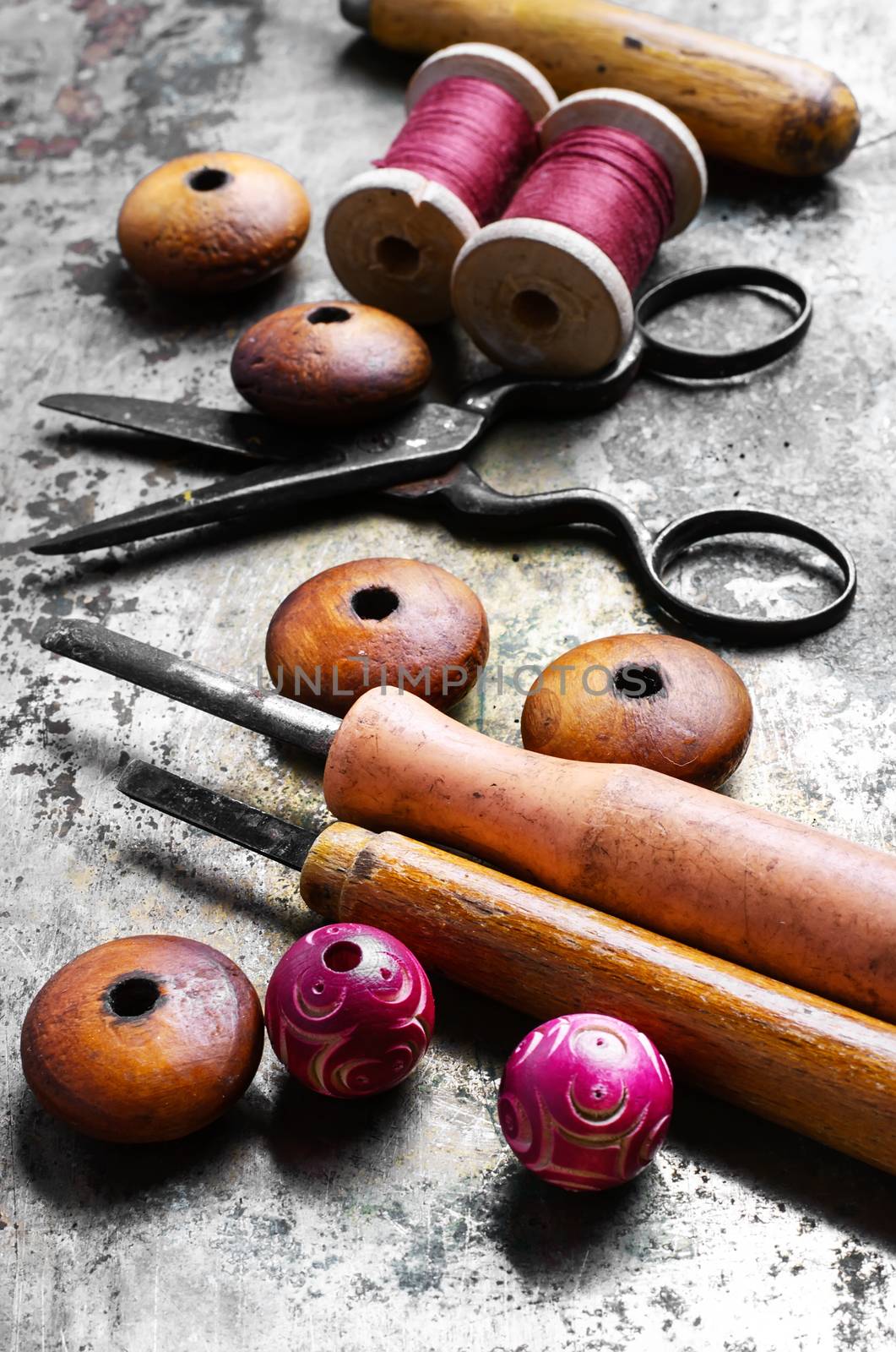 Wood beads jewelry and tool for making iron on vintage background
