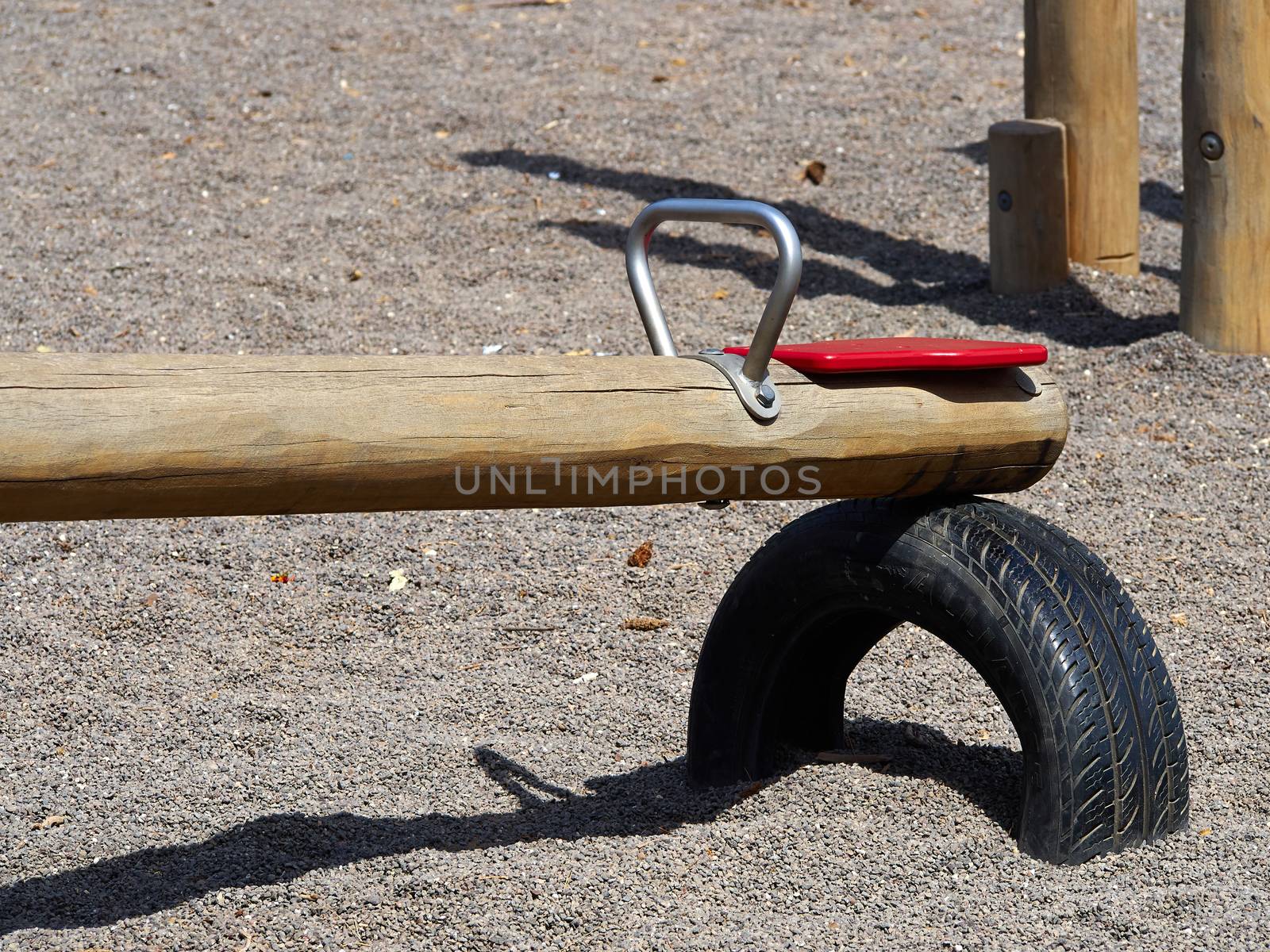 Seesaw teeter totter in a playground by Ronyzmbow