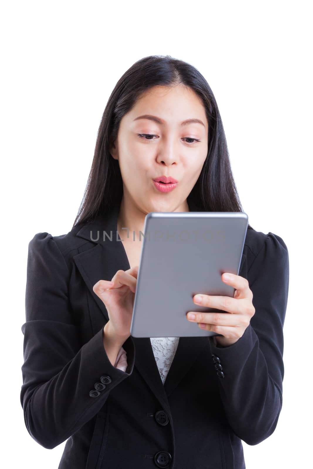 Young beautiful asian female posing with expressive emotion, exited, shocked, surprised, isolated on white background. Successful businesswoman with suit looking confident using digital tablet. Studio shot.