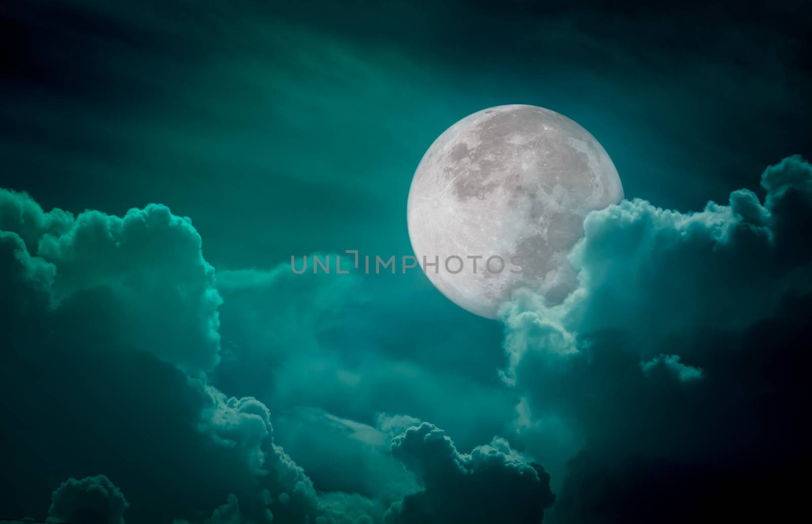 Attractive photo of a nighttime green sky with clouds, bright full moon would make a great background. Nightly sky with large moon. Beautiful nature use as background. Outdoors.