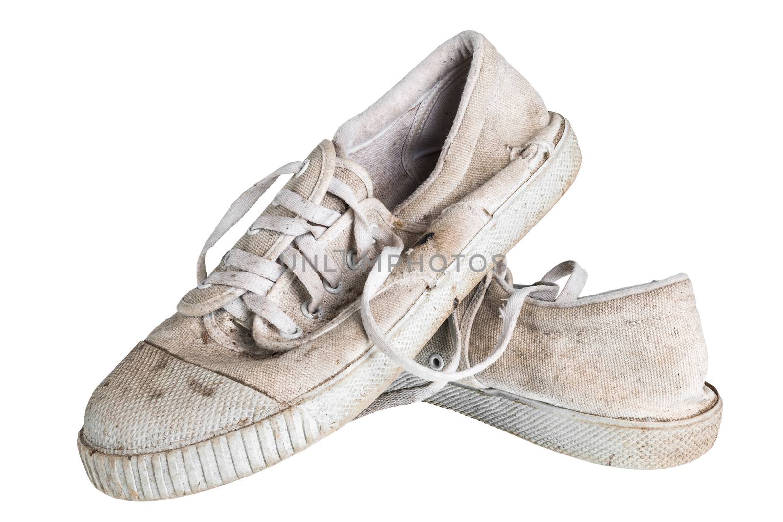 Close up a pair of dirty sneakers. Isolated on white background. by kdshutterman
