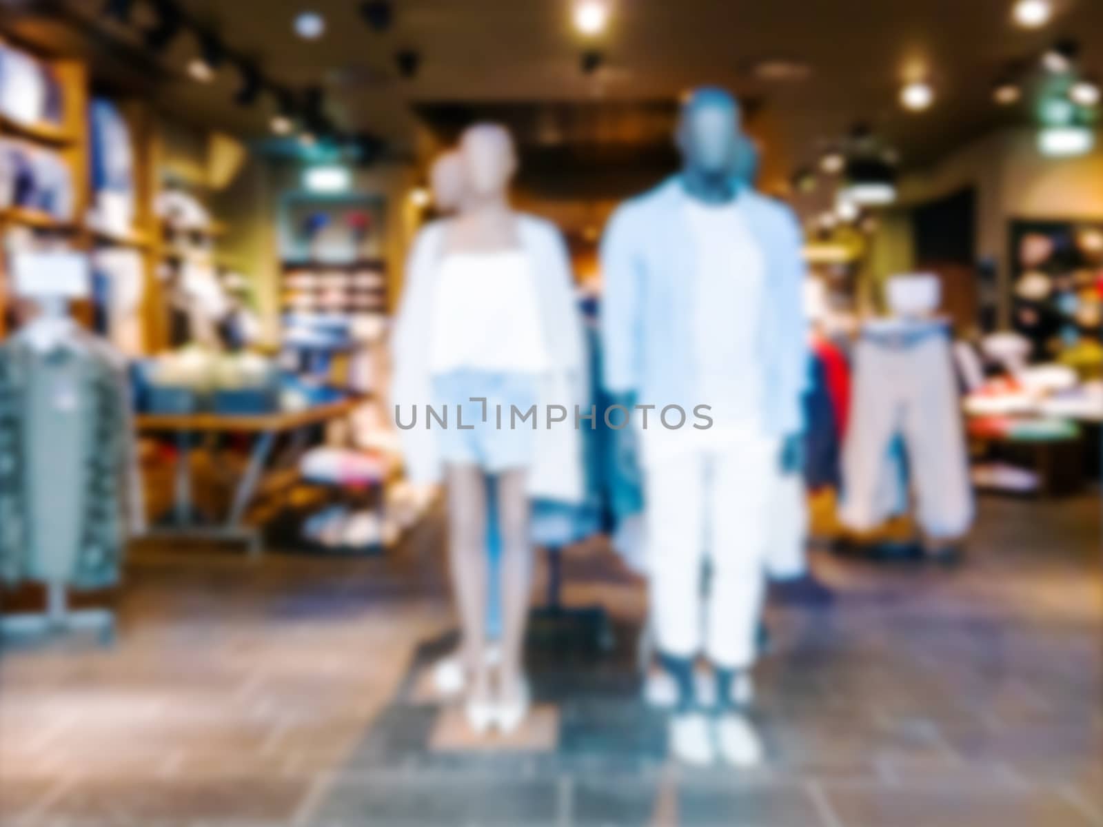 Blur dress store with customers and mannequins by fascinadora