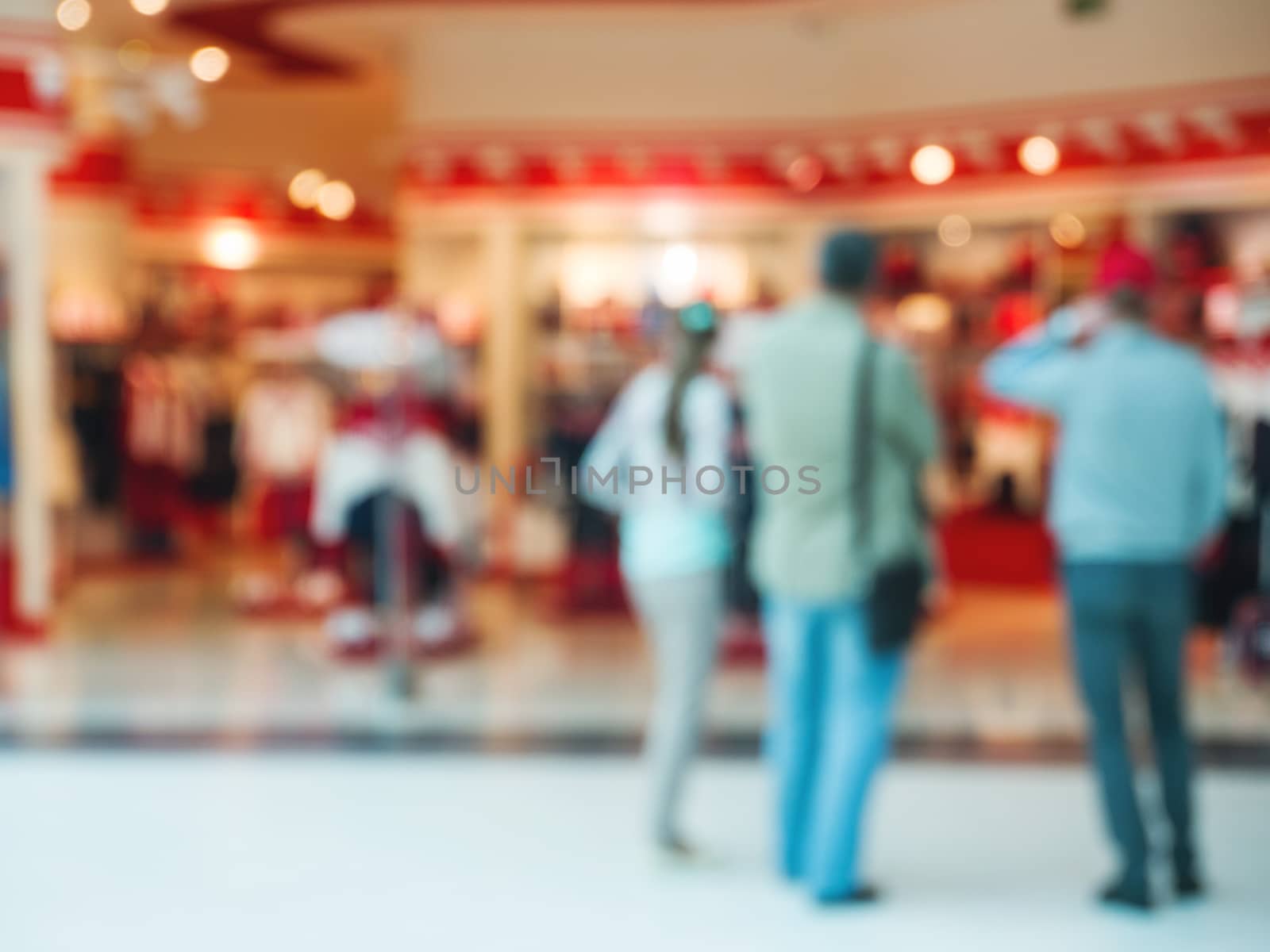 Abstract blurred shopping mall hall with unrecognizable persons as background