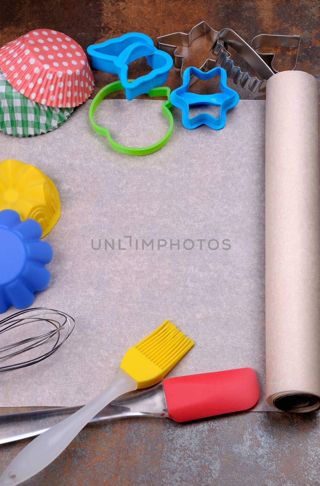 table with blank sheet of paper, baking cake ingredients and cooking utensils around. Background with free recipe text space.