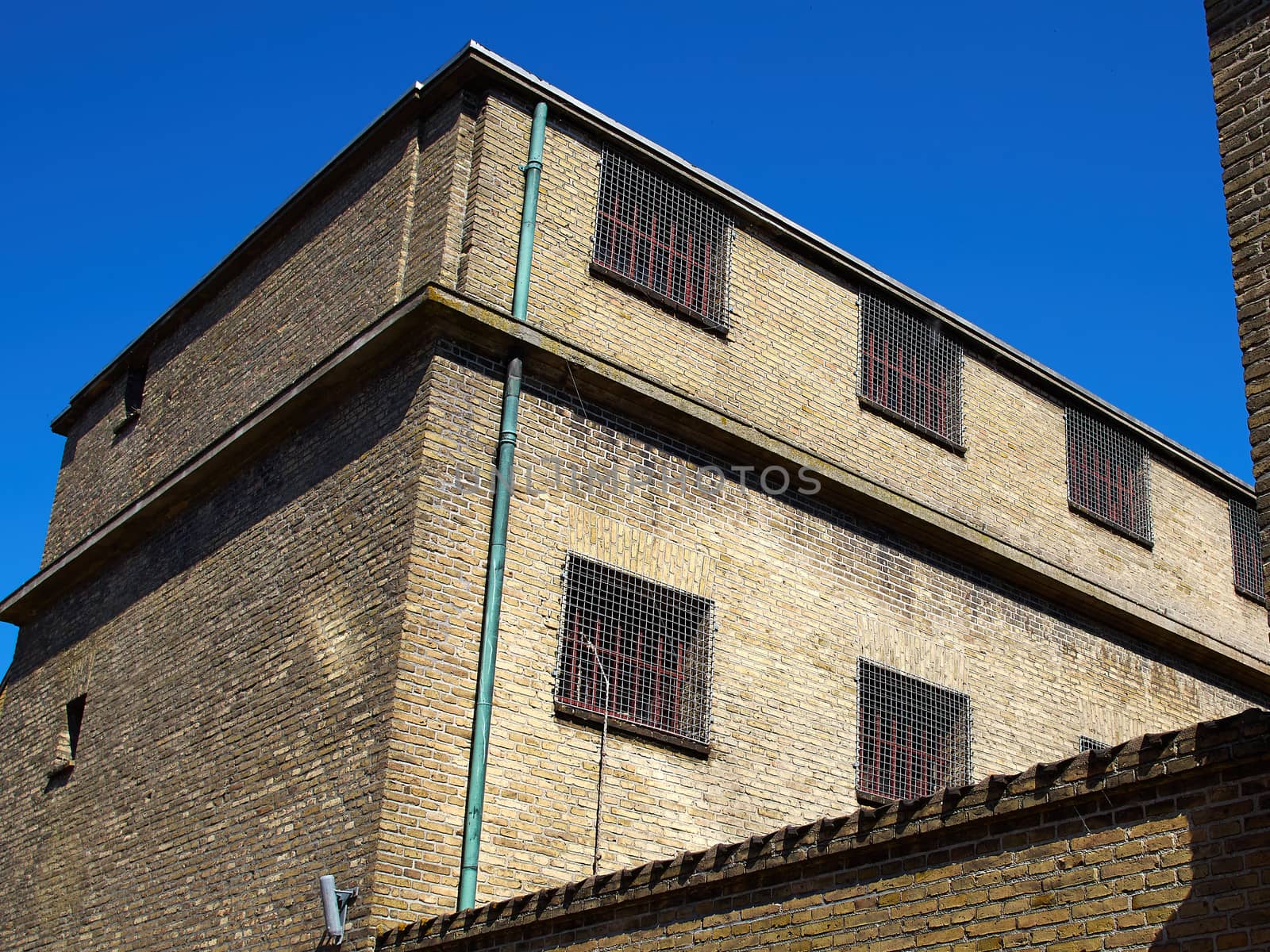Old prison jail and windows with heavy iron bars