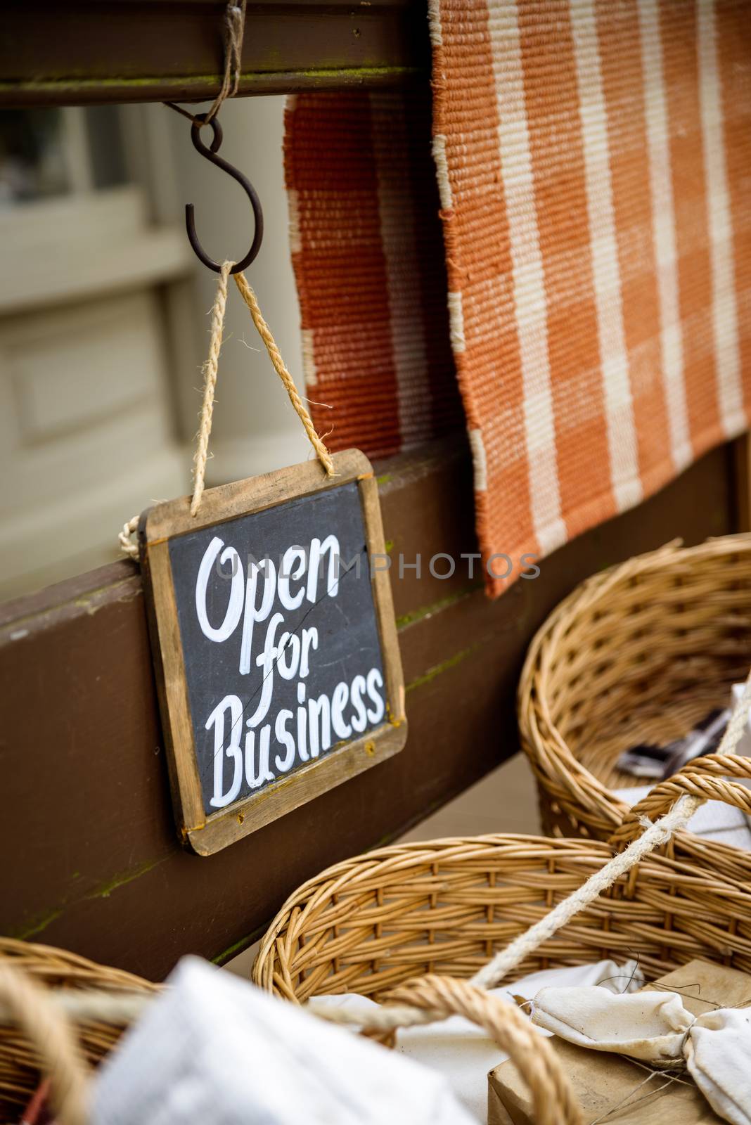 Open for business slate sign at a vintage looking shop