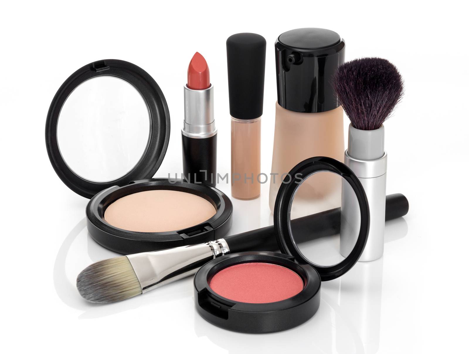 Makeup for fresh natural look. Foundation, concealer, face powder, blush, lipstick, brushes.